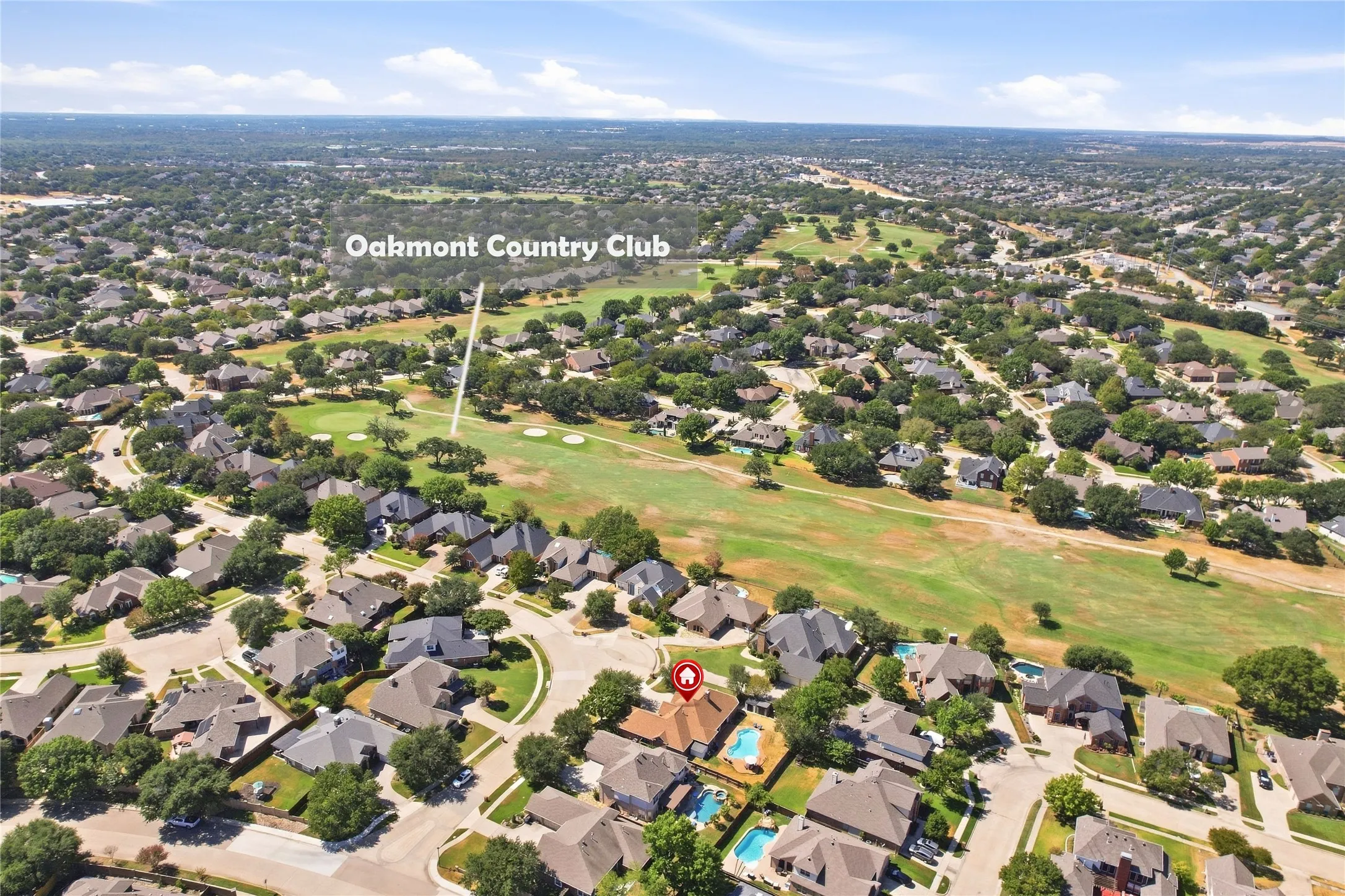 Residential properties with green space, mature trees, and a golf course