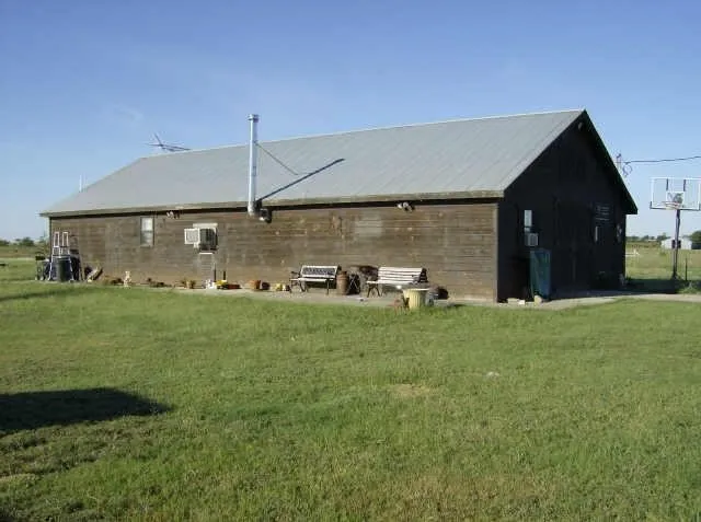 Rear view of property featuring a lawn