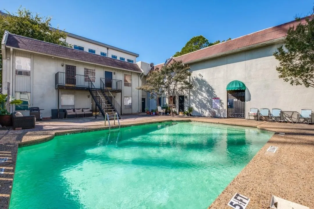 Sparkling swimming pool with a textured concrete surround