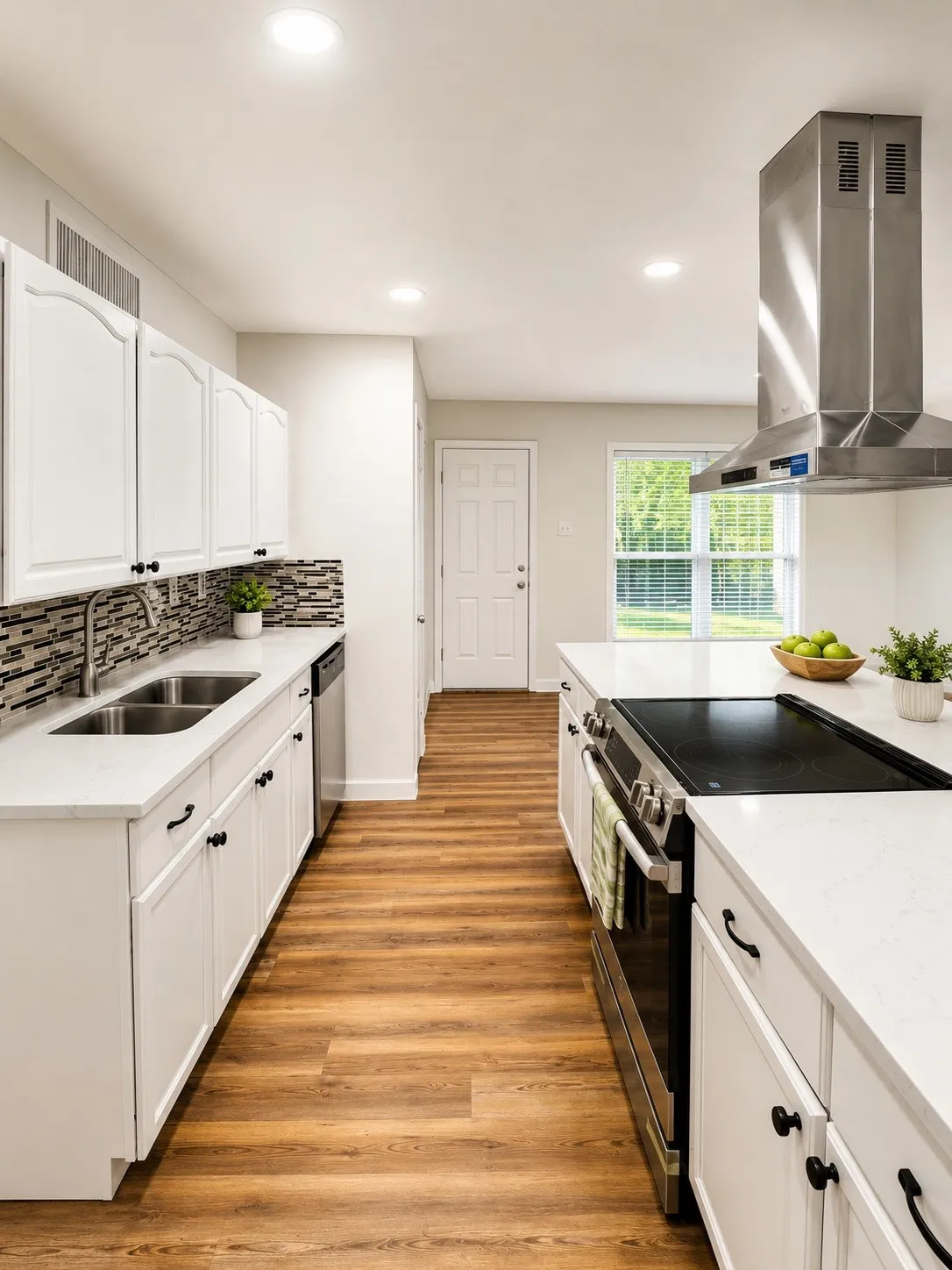 Kitchen featuring white cabinetry, wood-finish flooring, recessed lighting, and a stainless steel range hood