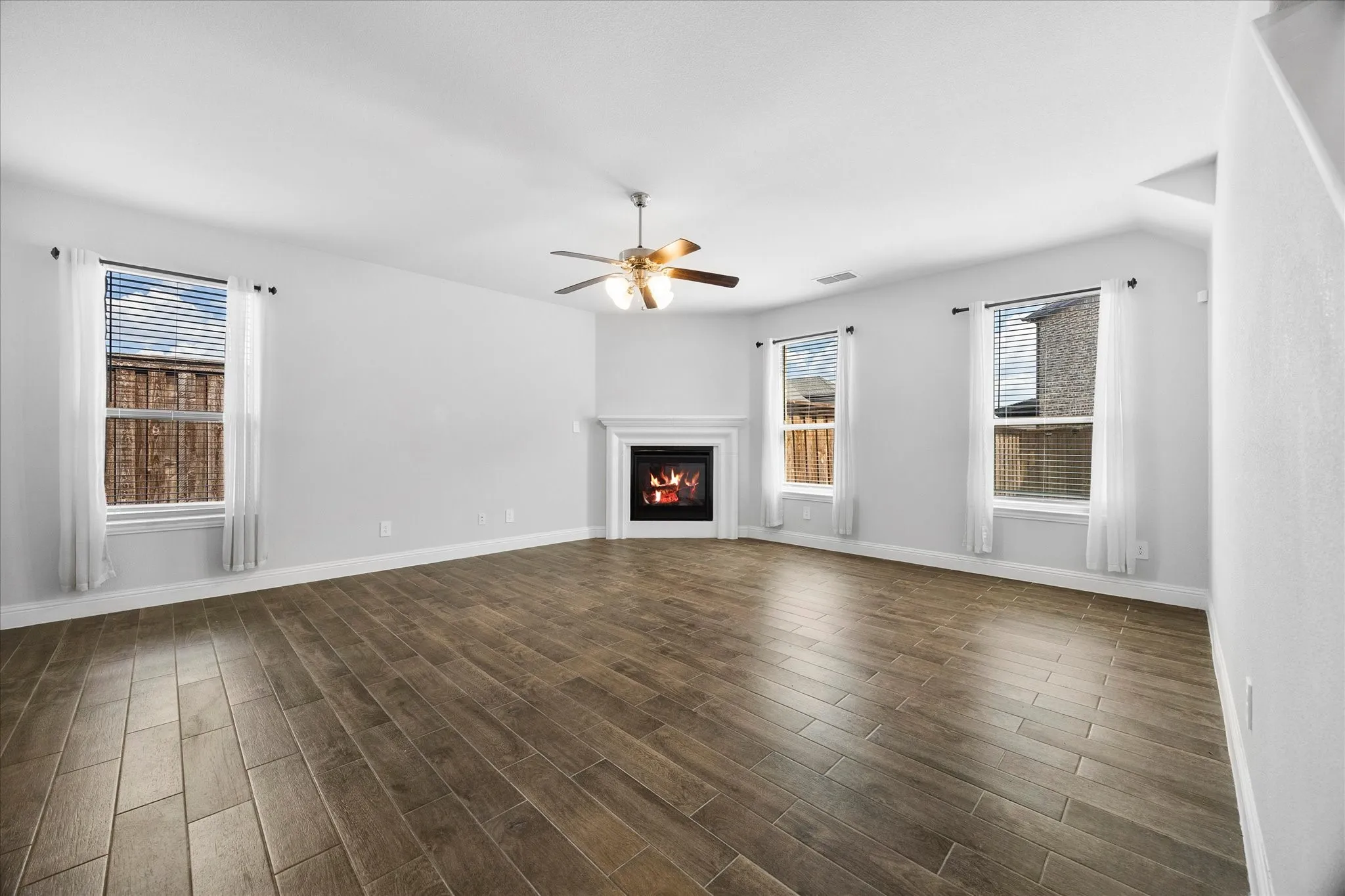 Gorgeous family room includes beautiful fireplace