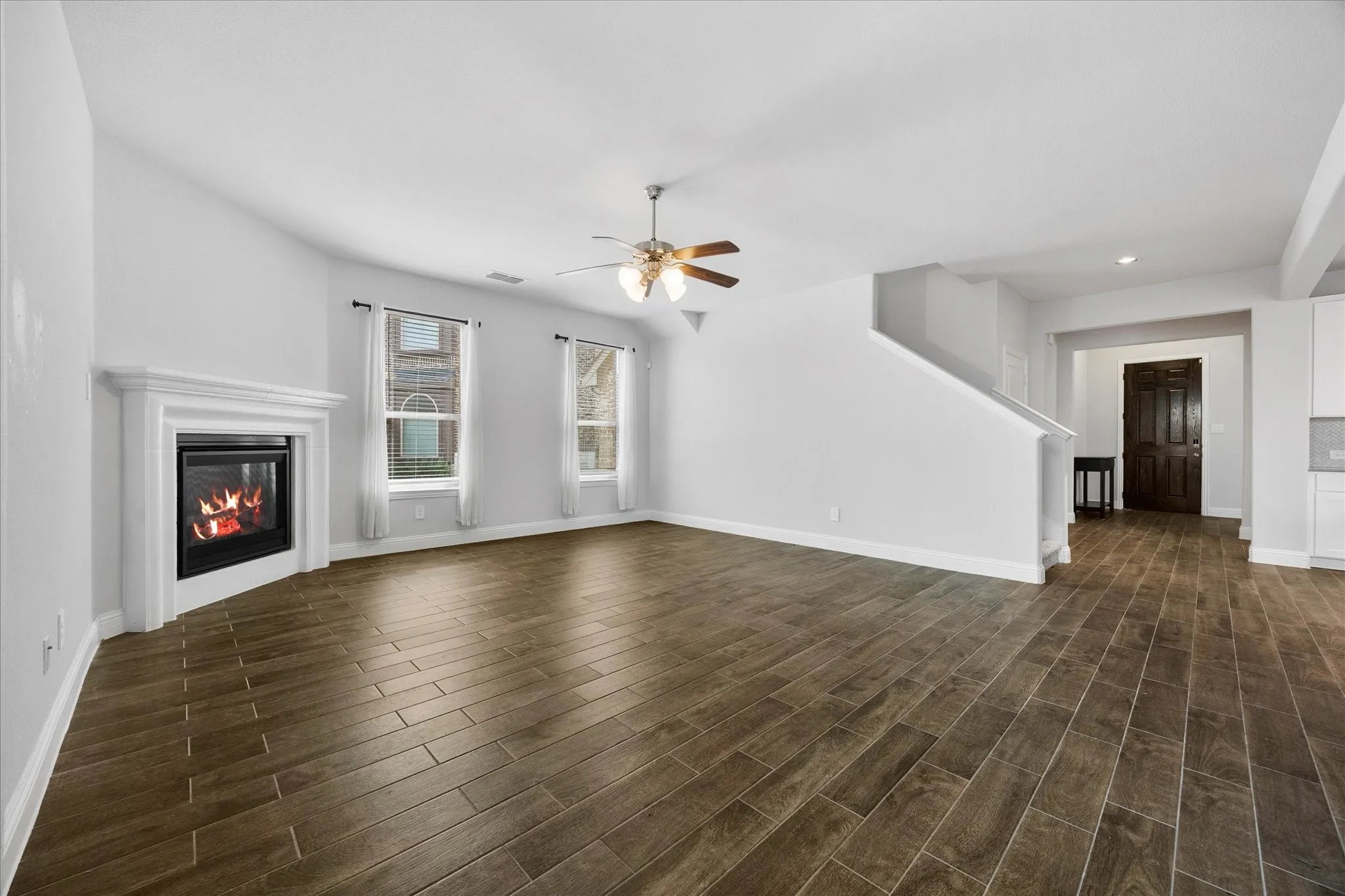Staircase opens onto lovely family room