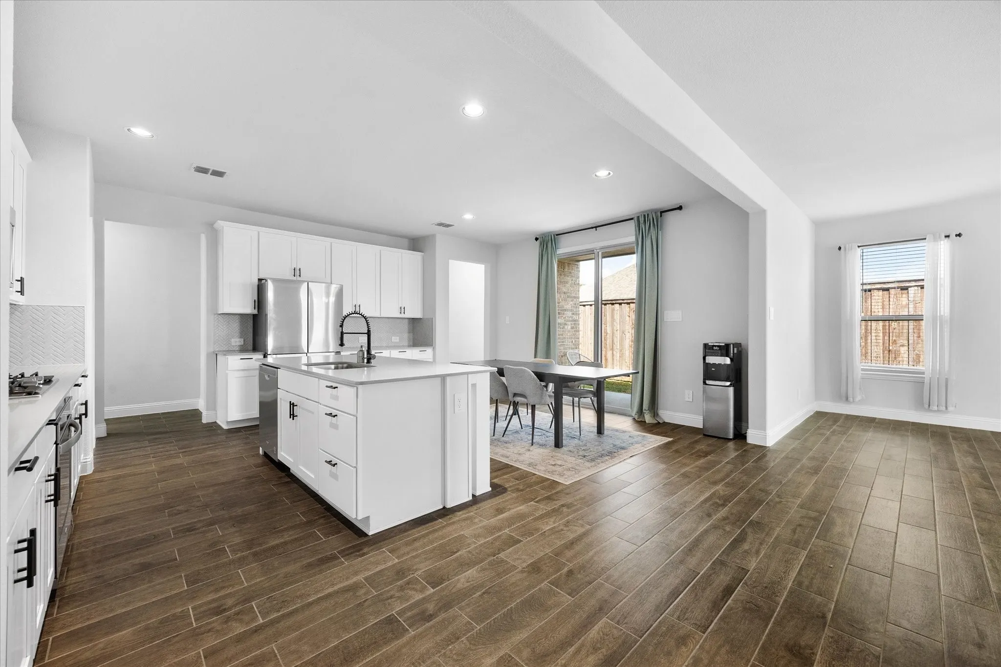 Open floor plan features dream kitchen opening onto dining area and family room