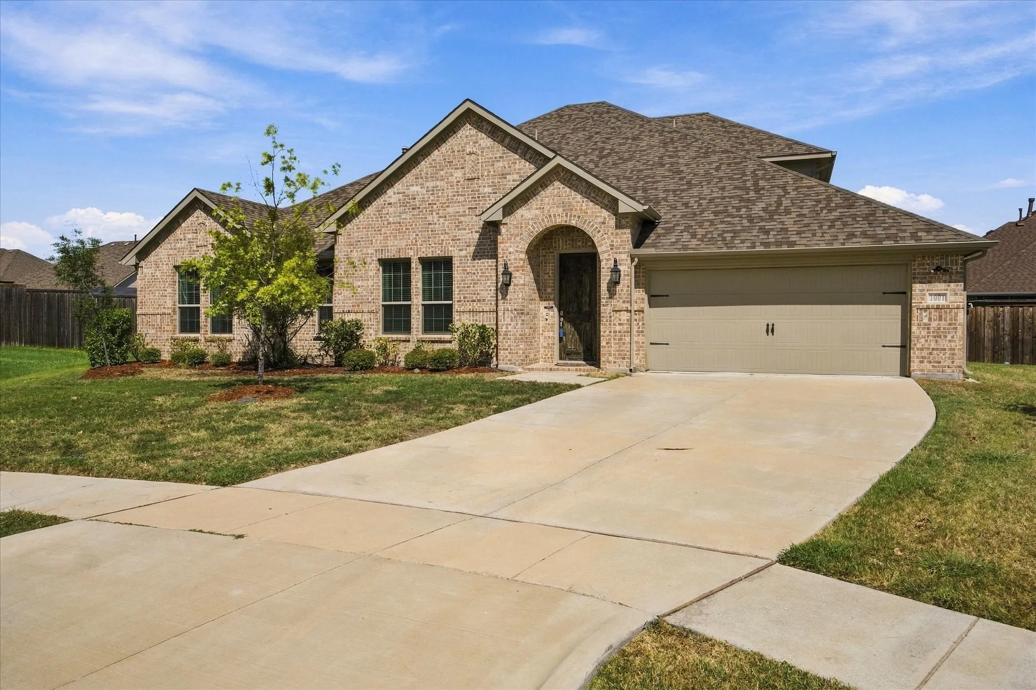 Extended drive and 2 car garage provides ample parking spaces for your family and friends