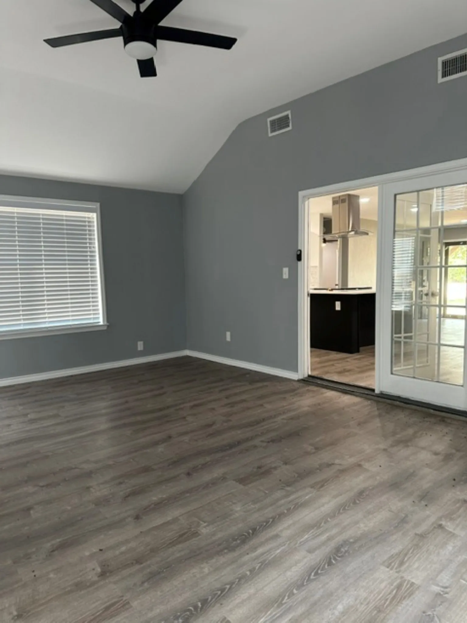 Office view looking thru french doors into kitchen area