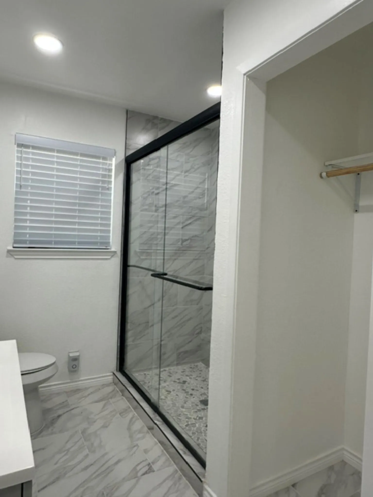 Halll bathroom with walkin shower and closet