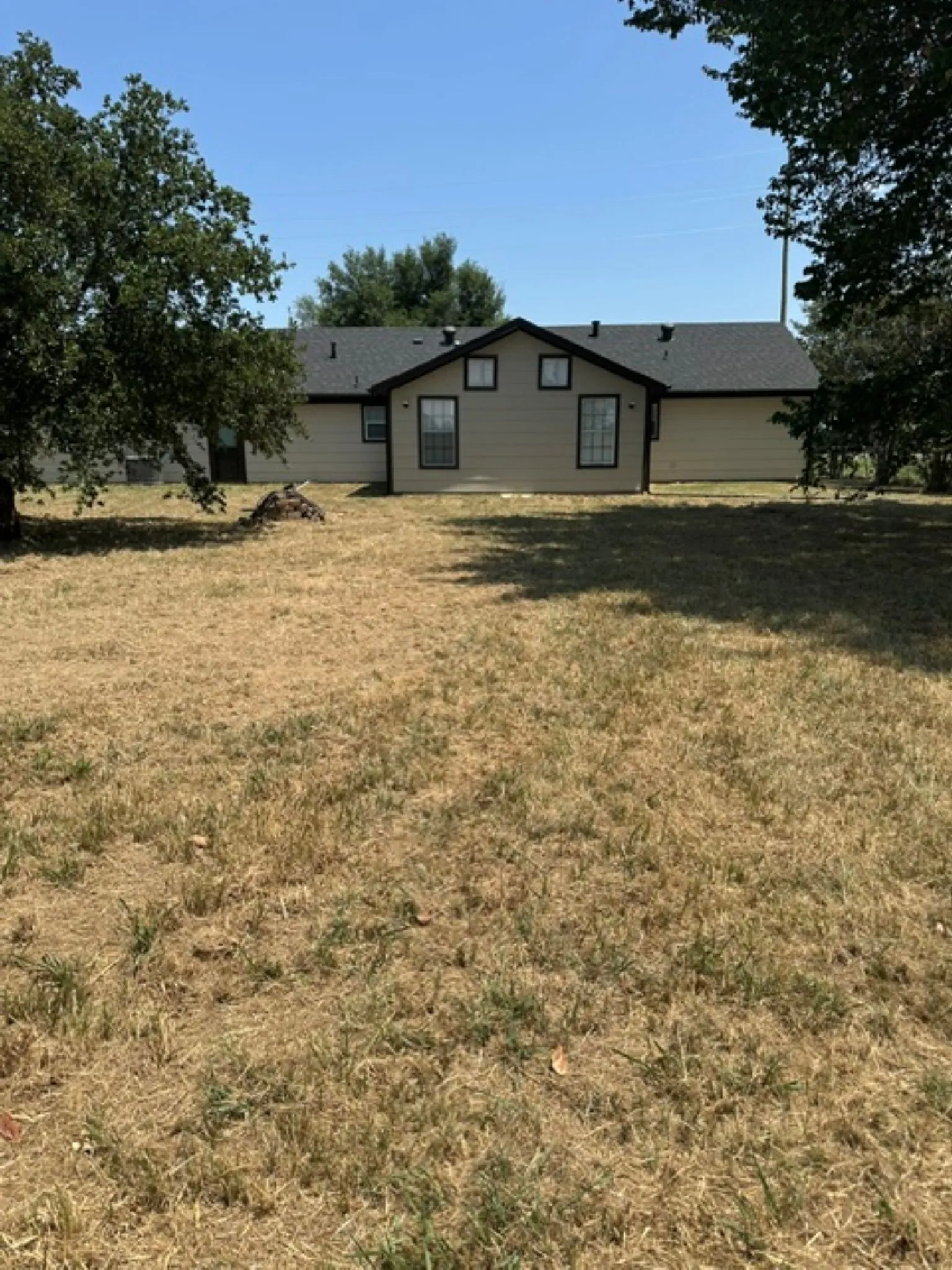 Back view of house from  storage building
