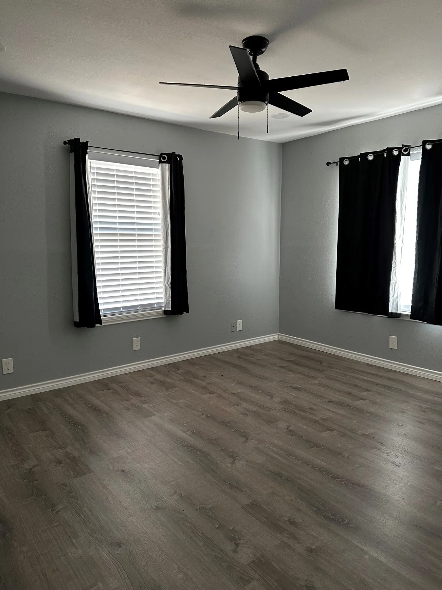 Front corner bedroom with fan and spots