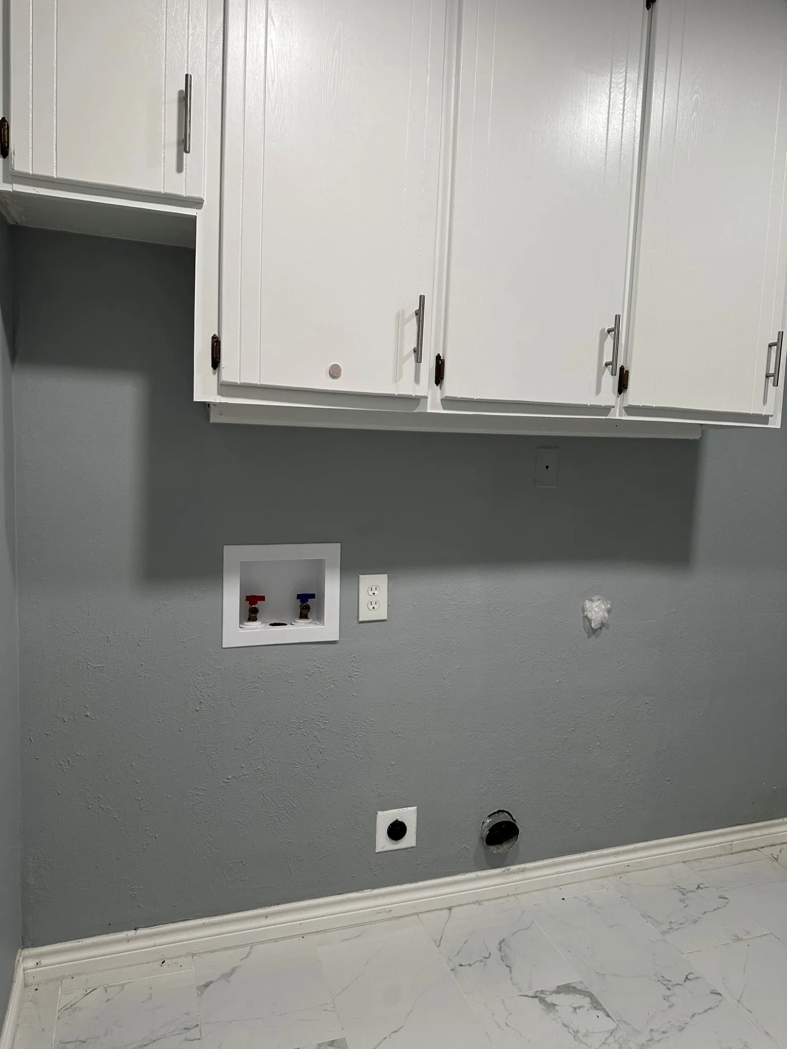 Laundry room view coming in from garage