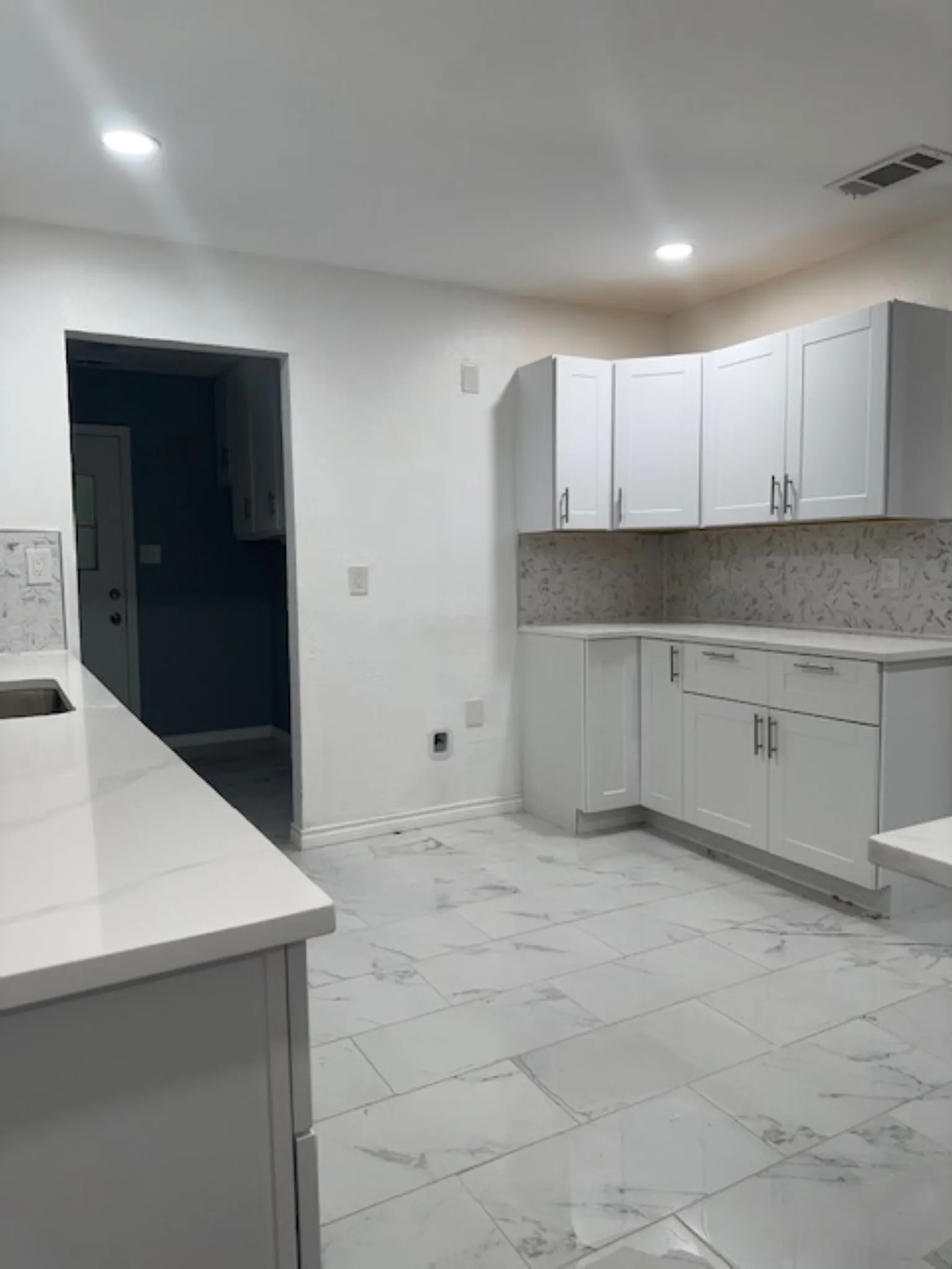 Another kitchen view of kitchen cabinets
