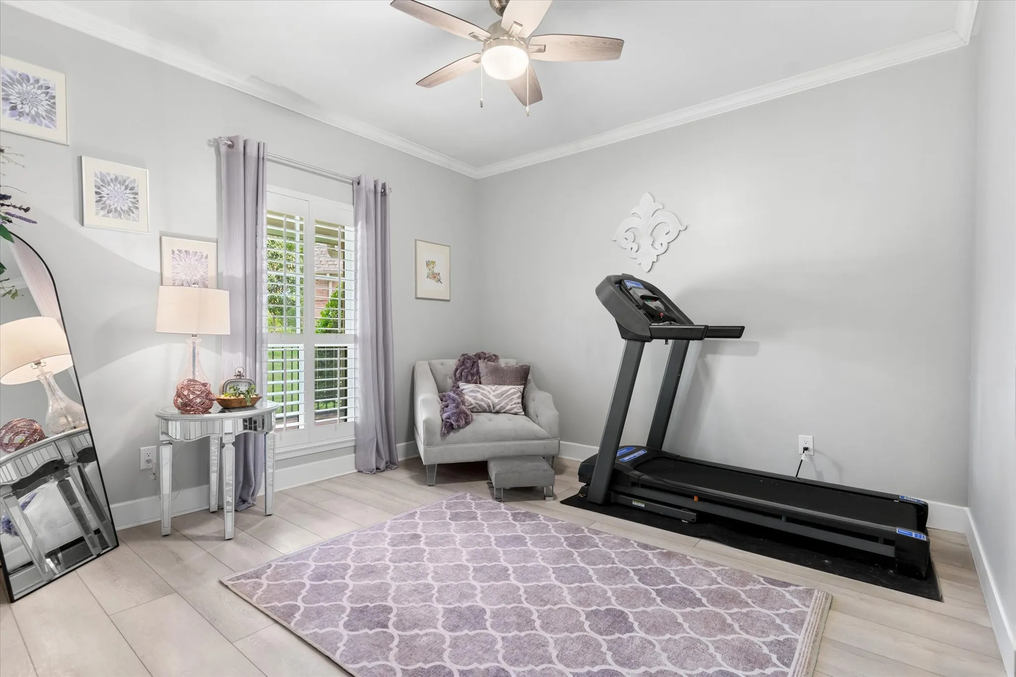 Light wood-finish flooring with white baseboards