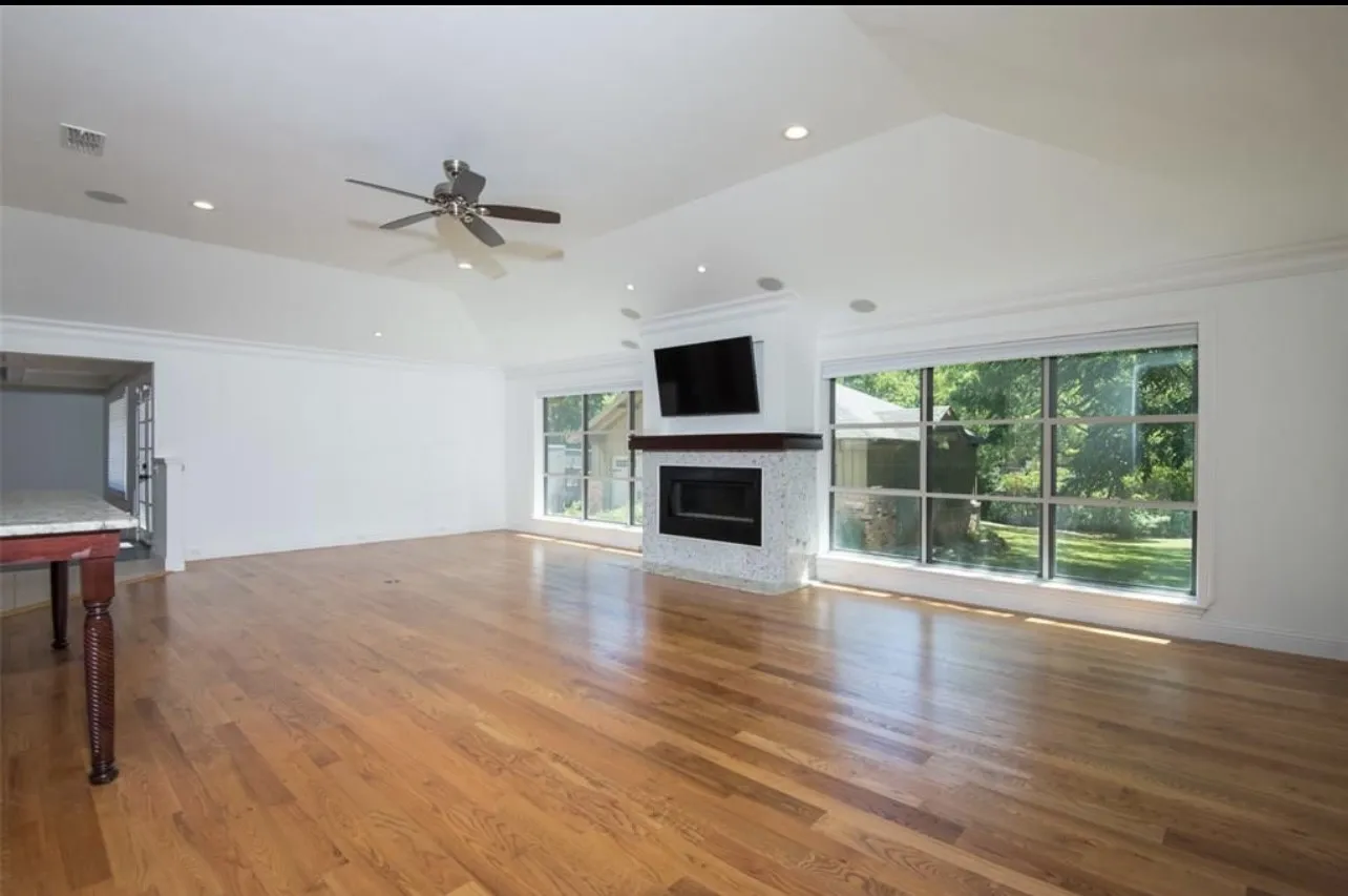Vaulted ceiling featuring recessed lighting and a ceiling fan