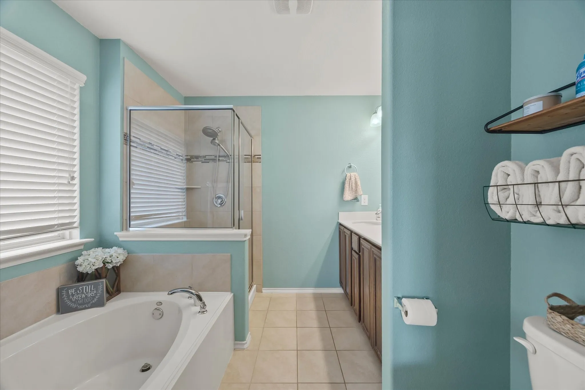 Soaking tub with deck-mounted faucet