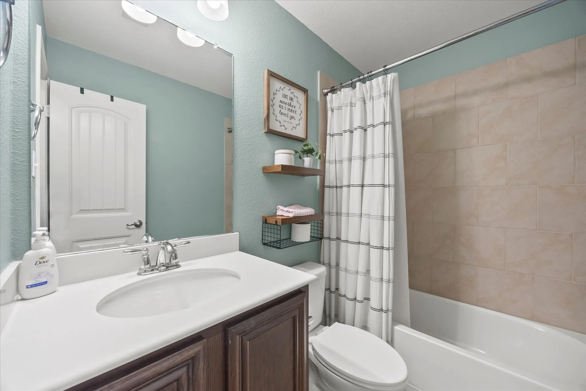 White vanity countertop with an integrated sink and chrome faucet