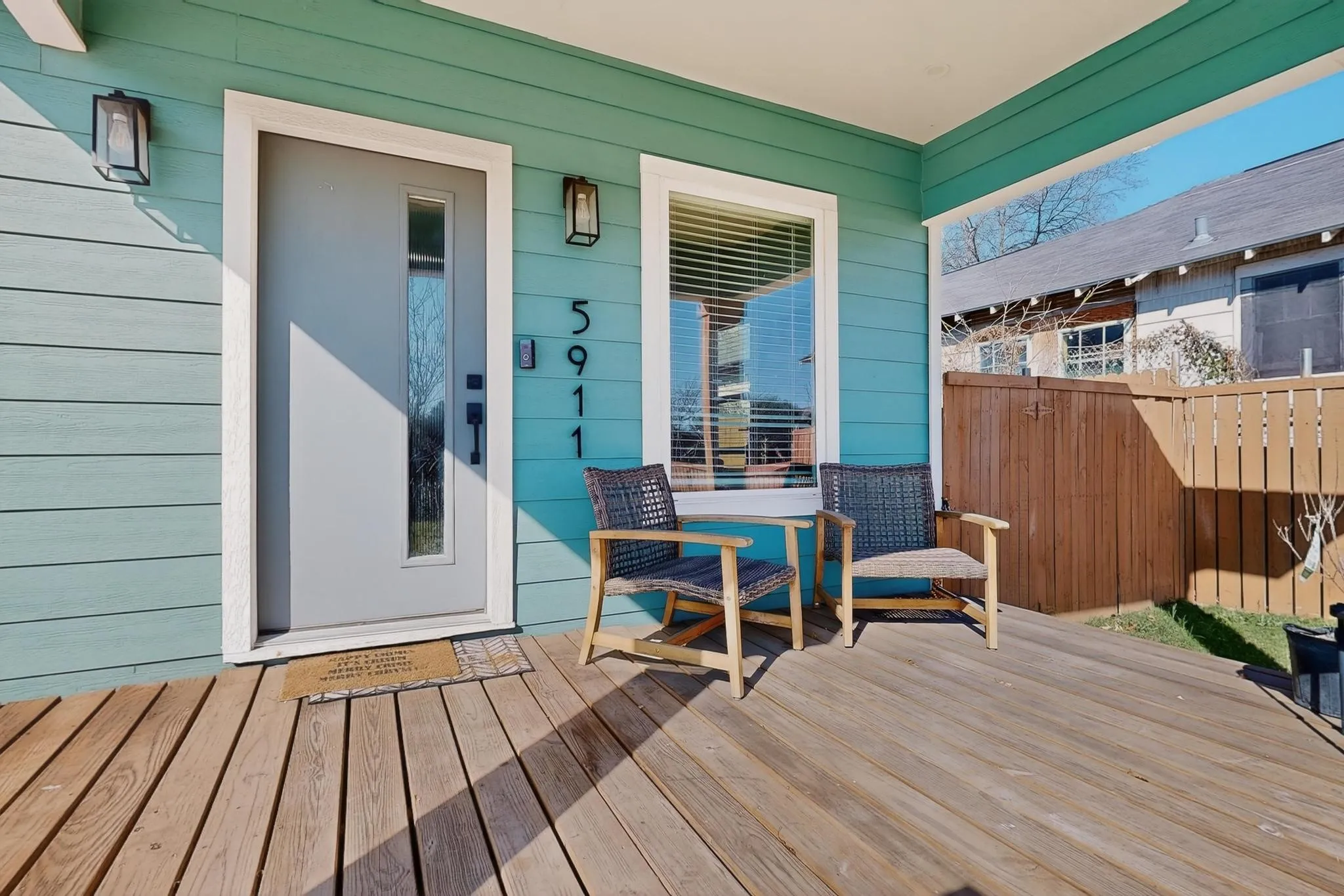 Covered front porch featuring wood-finish flooring
