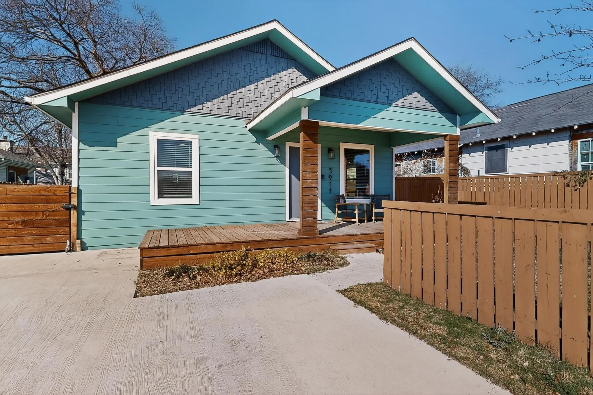 Turquoise exterior with horizontal siding and decorative shake accents