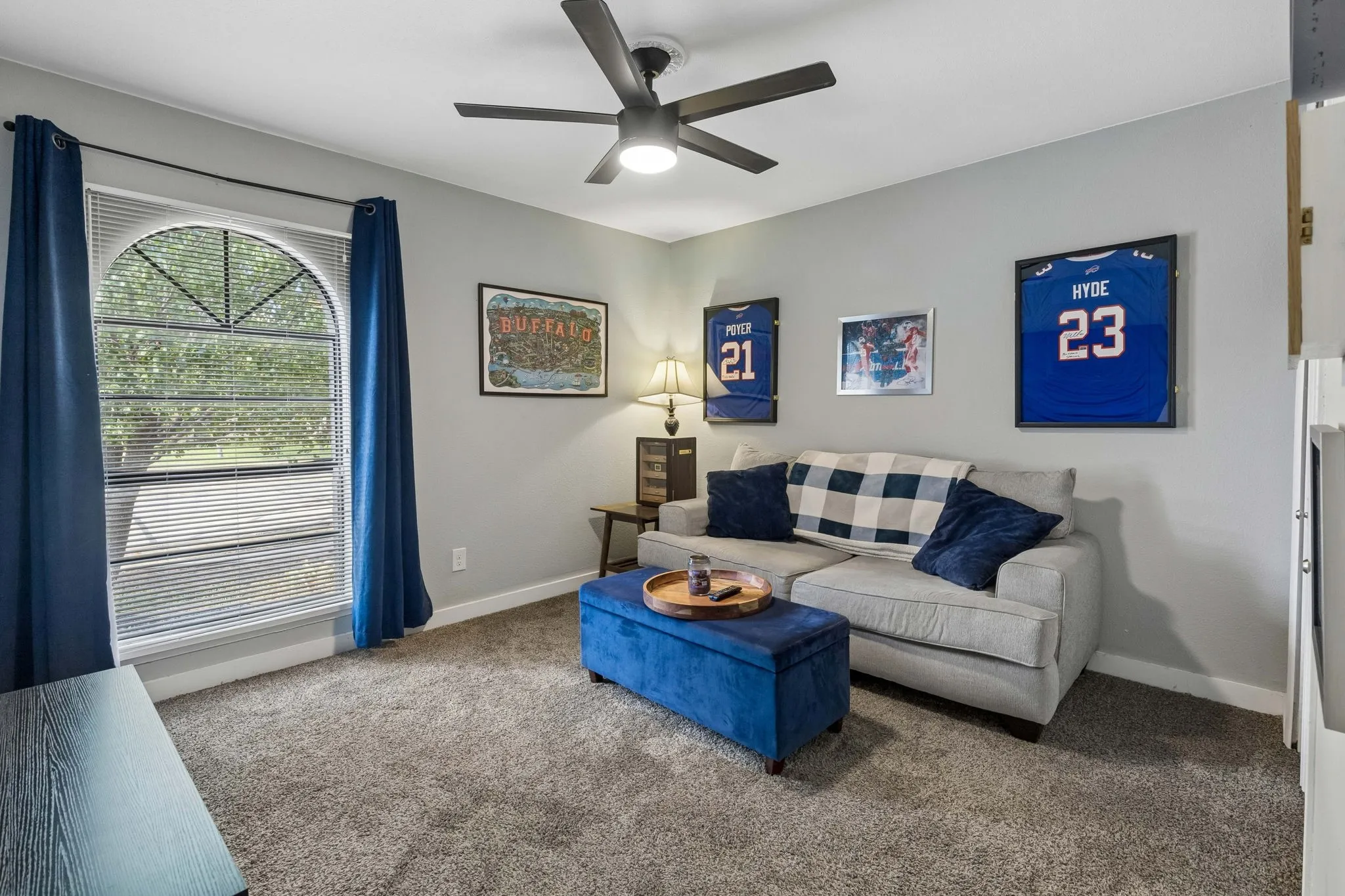 Flexible Additional Bedroom - A spacious footprint, soft carpeting, ceiling fan, and distinctive arched window create a comfortable room ready to adapt to changing needs.