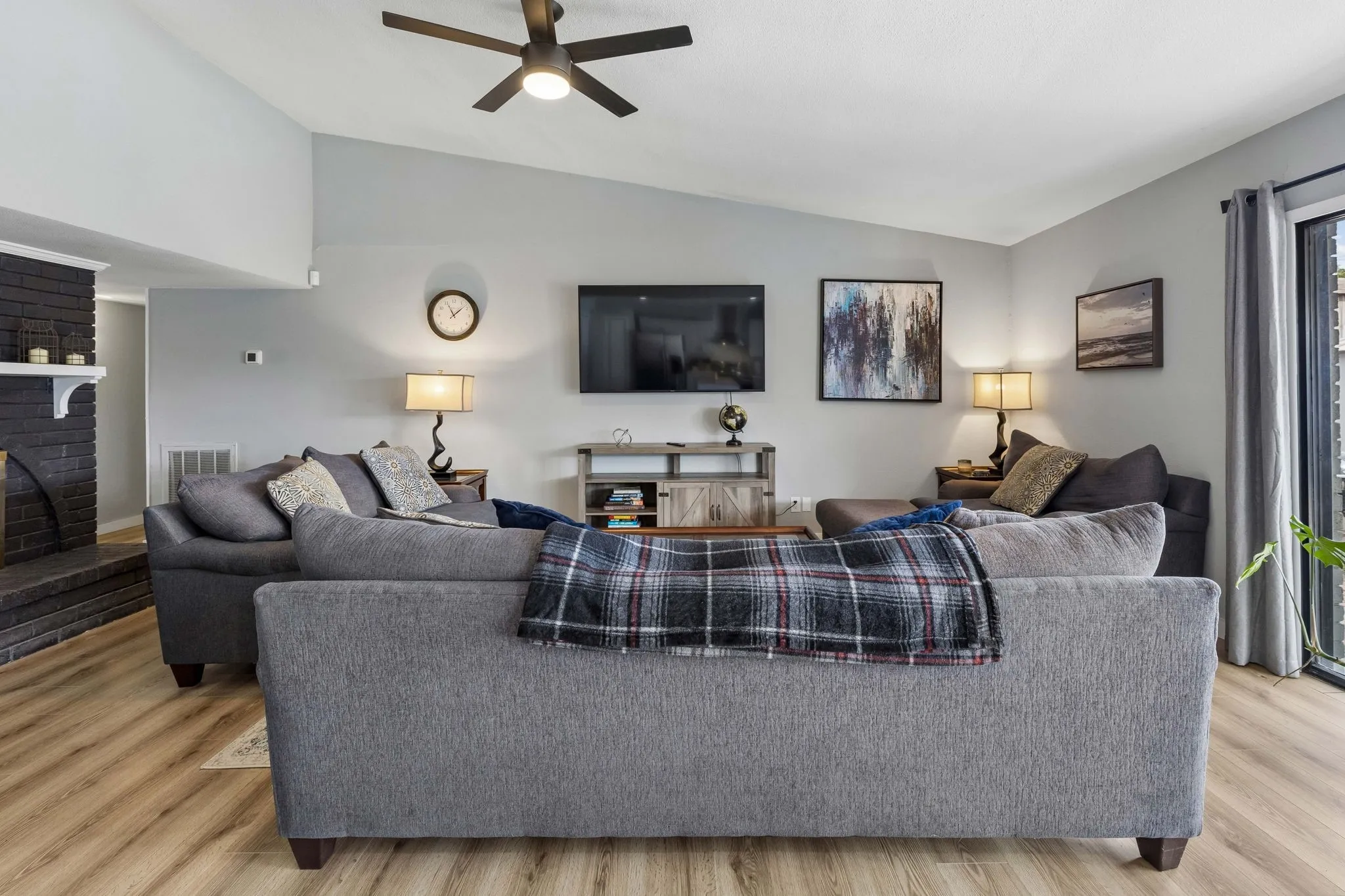 Comfortable Space to Gather - Generous wall space, continuous laminate flooring, and the elevated ceiling give the family room flexibility for everyday living, relaxing, and entertaining.