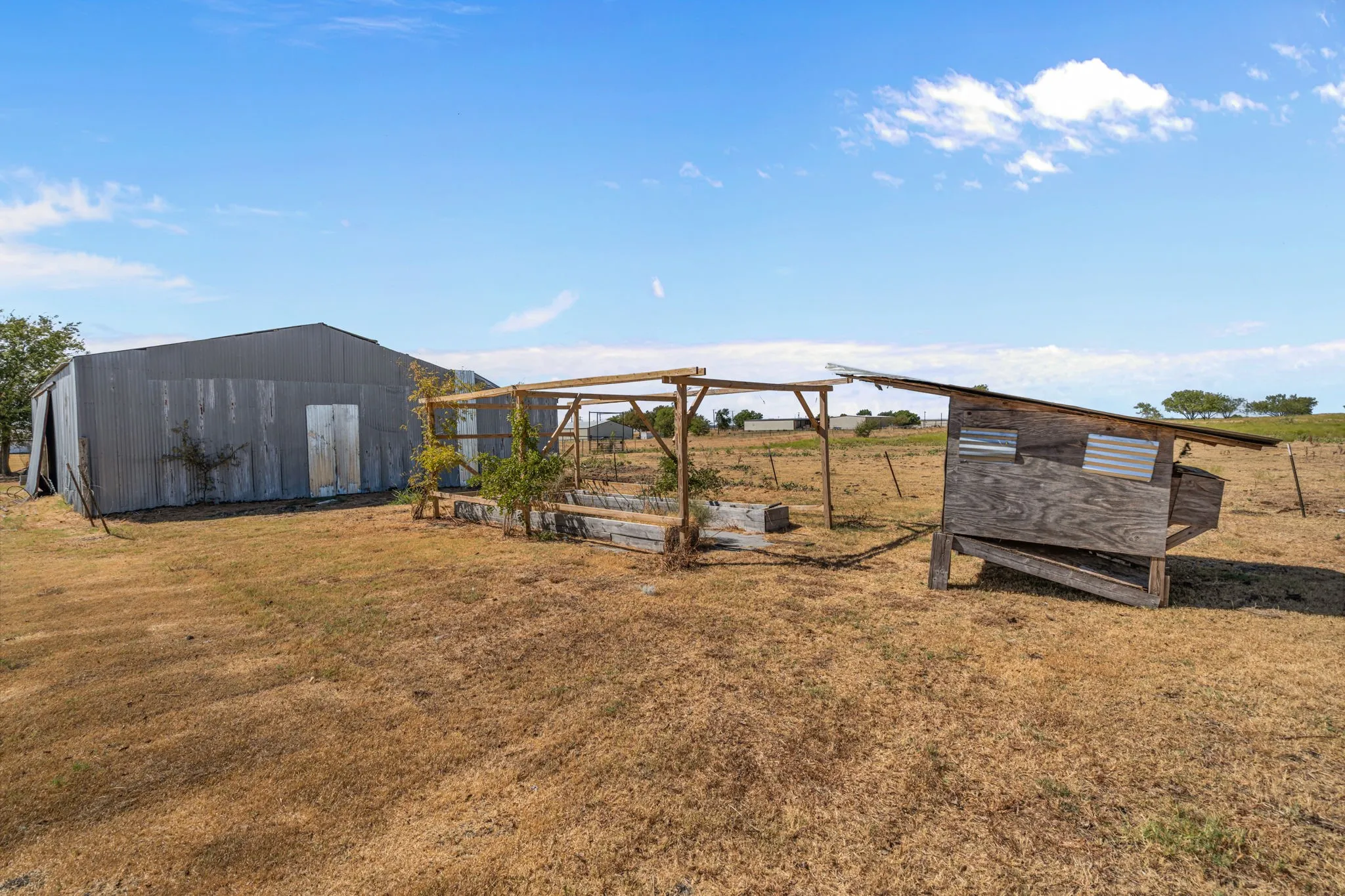Back yard with gardens and chicken coops