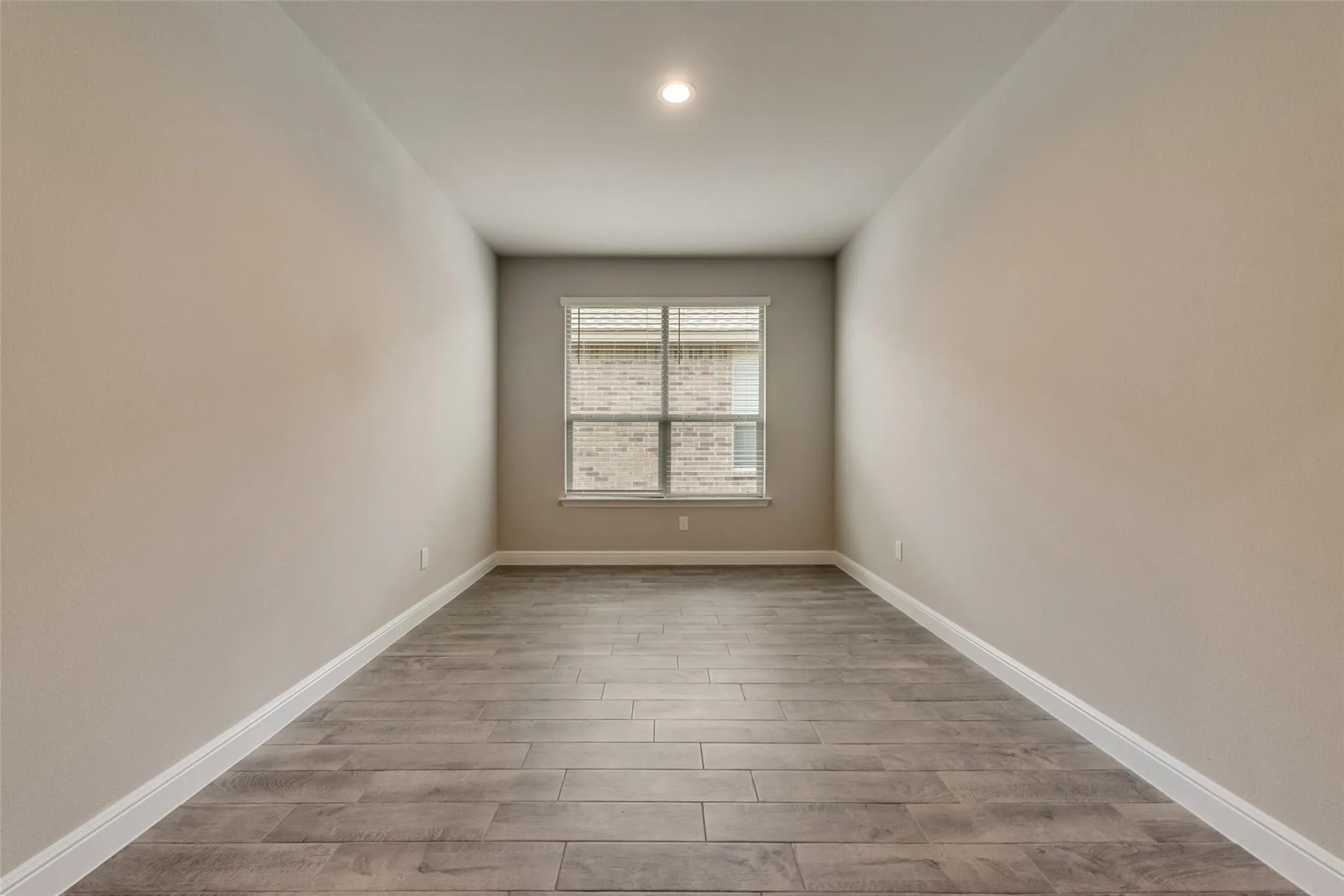 Spare room with hardwood / wood-style flooring