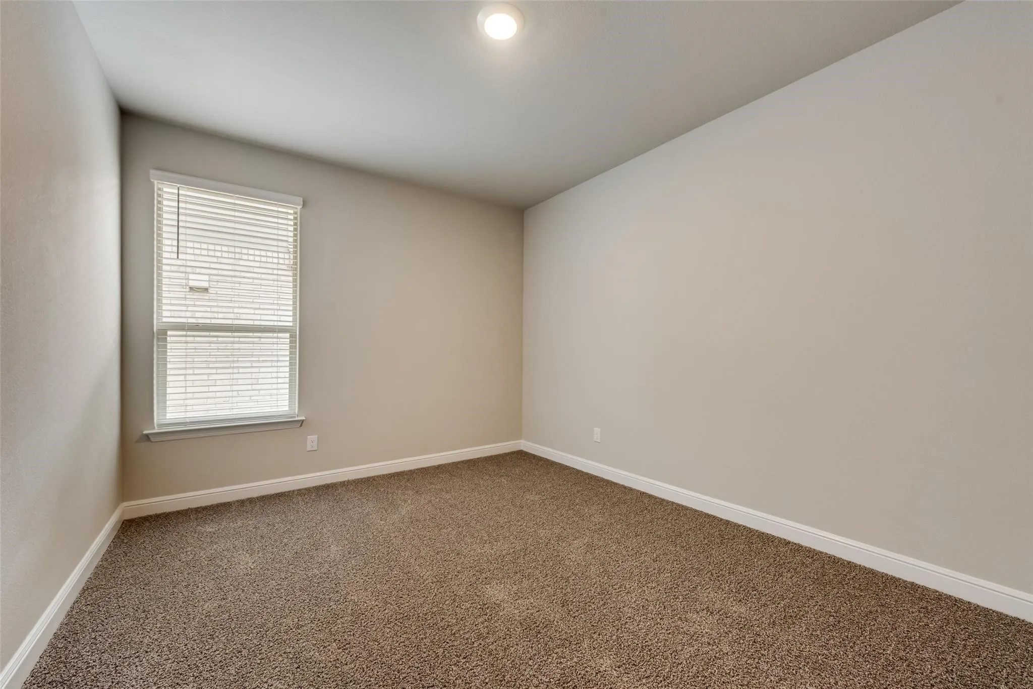 Empty room featuring carpet flooring