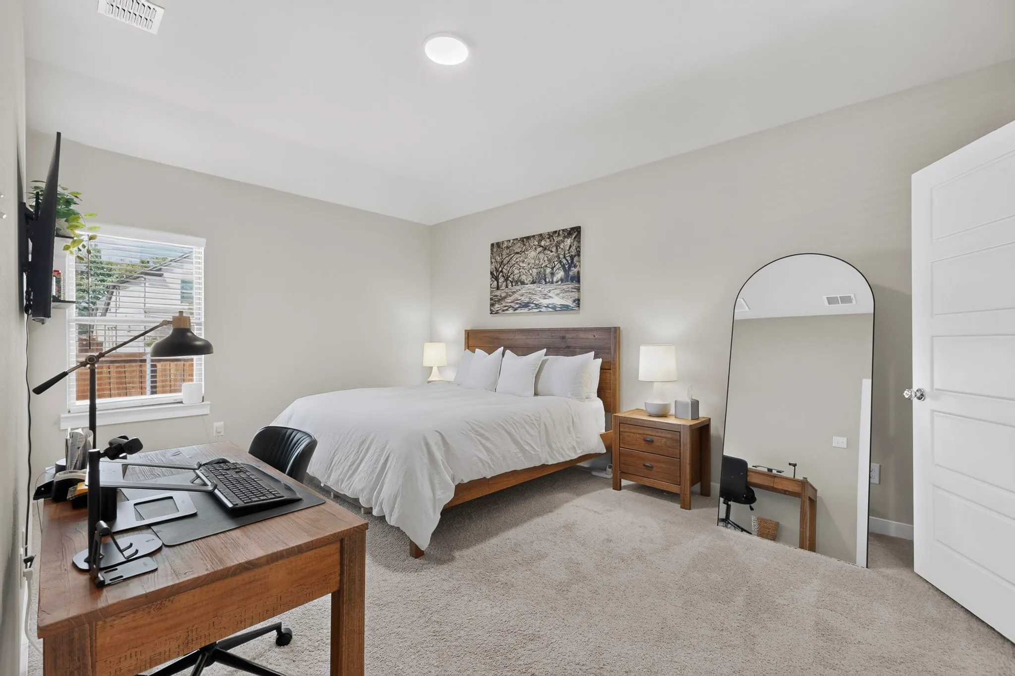 Recessed ceiling lighting, window with blinds, light gray wall paint, and gray carpet flooring