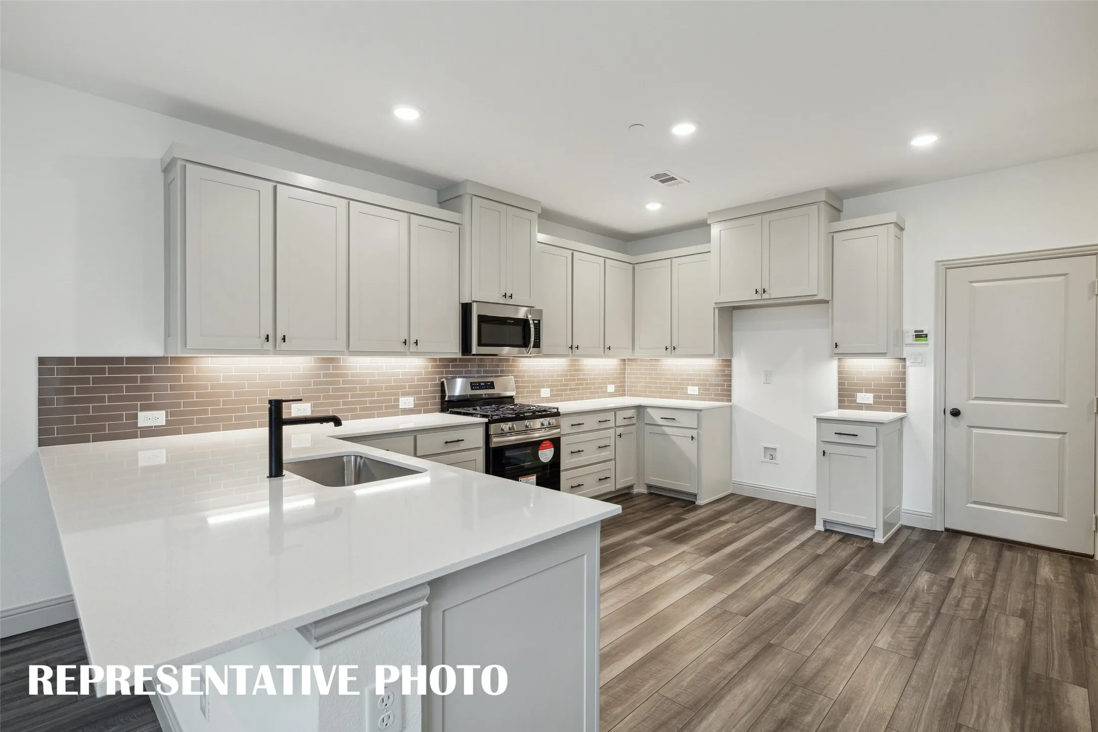 No shortage of space, storage or style in this dream kitchen!  REPRESENTATIVE PHOTO
