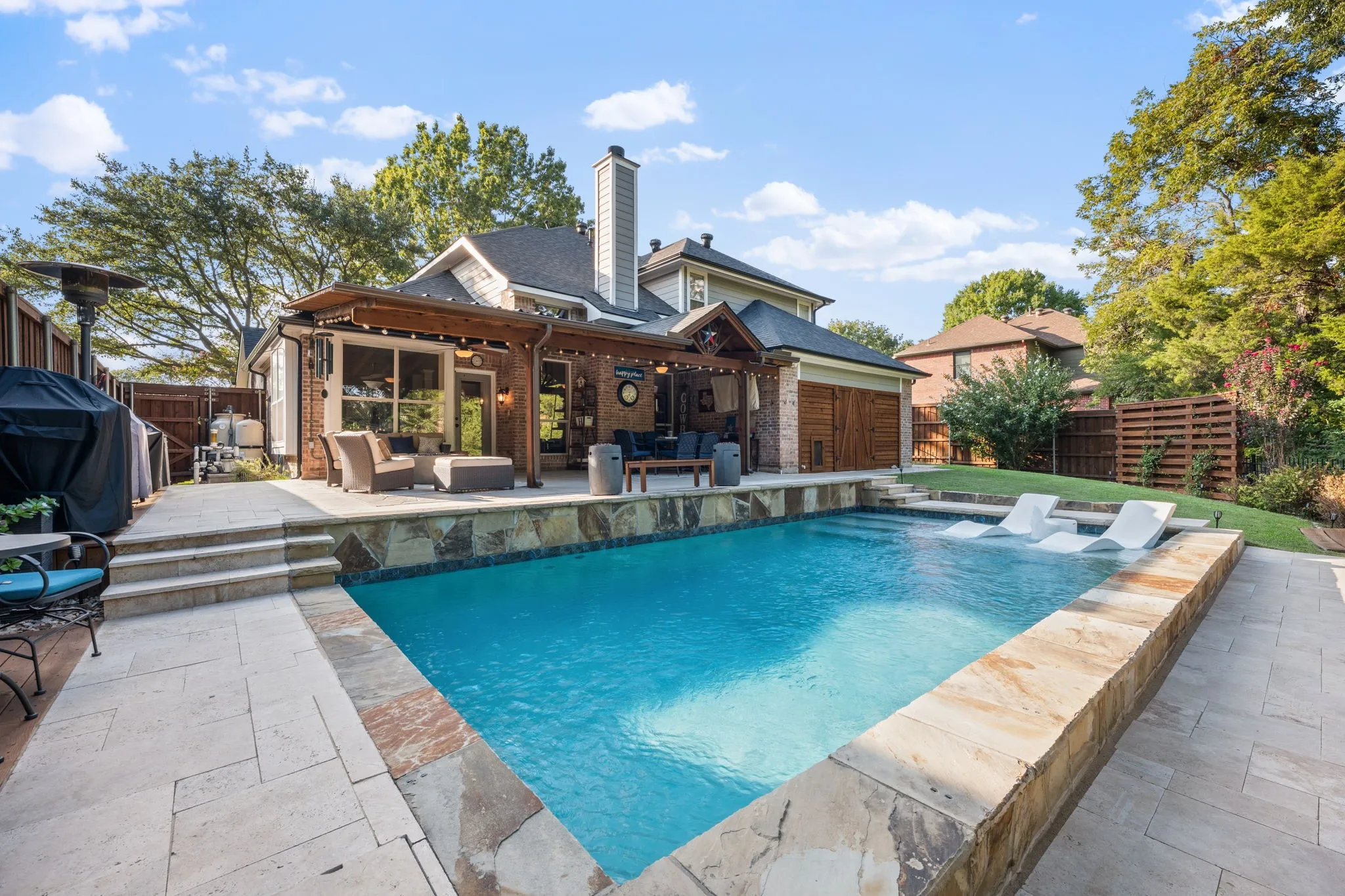Expansive backyard featuring a pool added in 2021 with pool chiller added in 2022 for hot summer days
