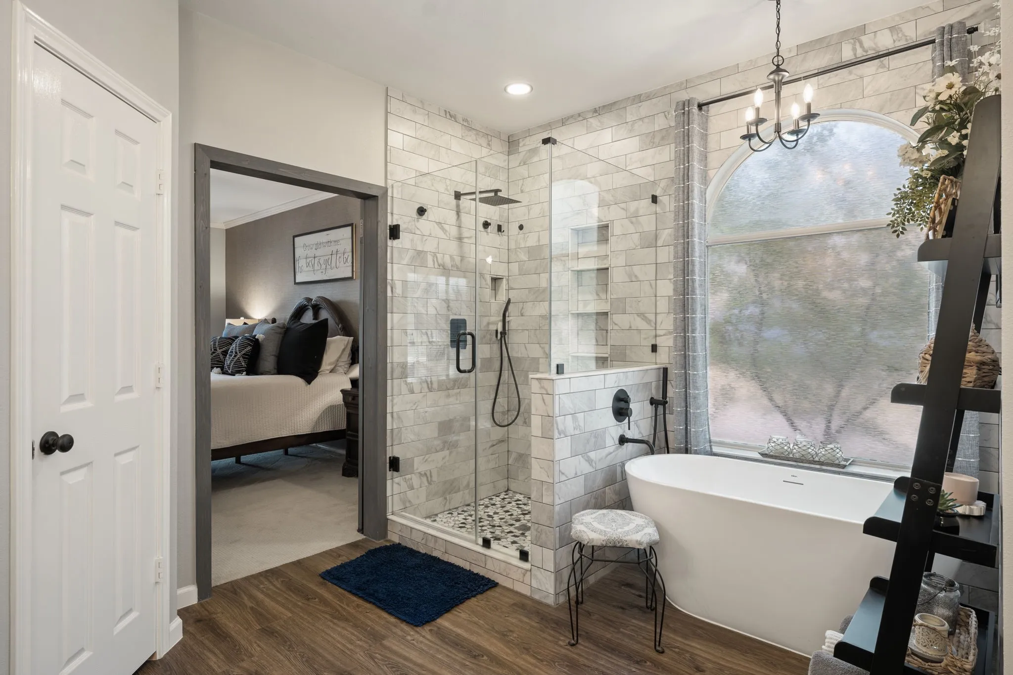 Bathroom featuring a freestanding soaking tub, walk-in frameless shower