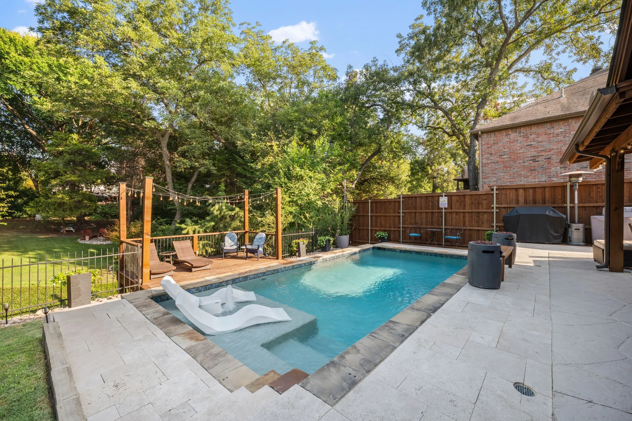 Stunning view of pool and yard