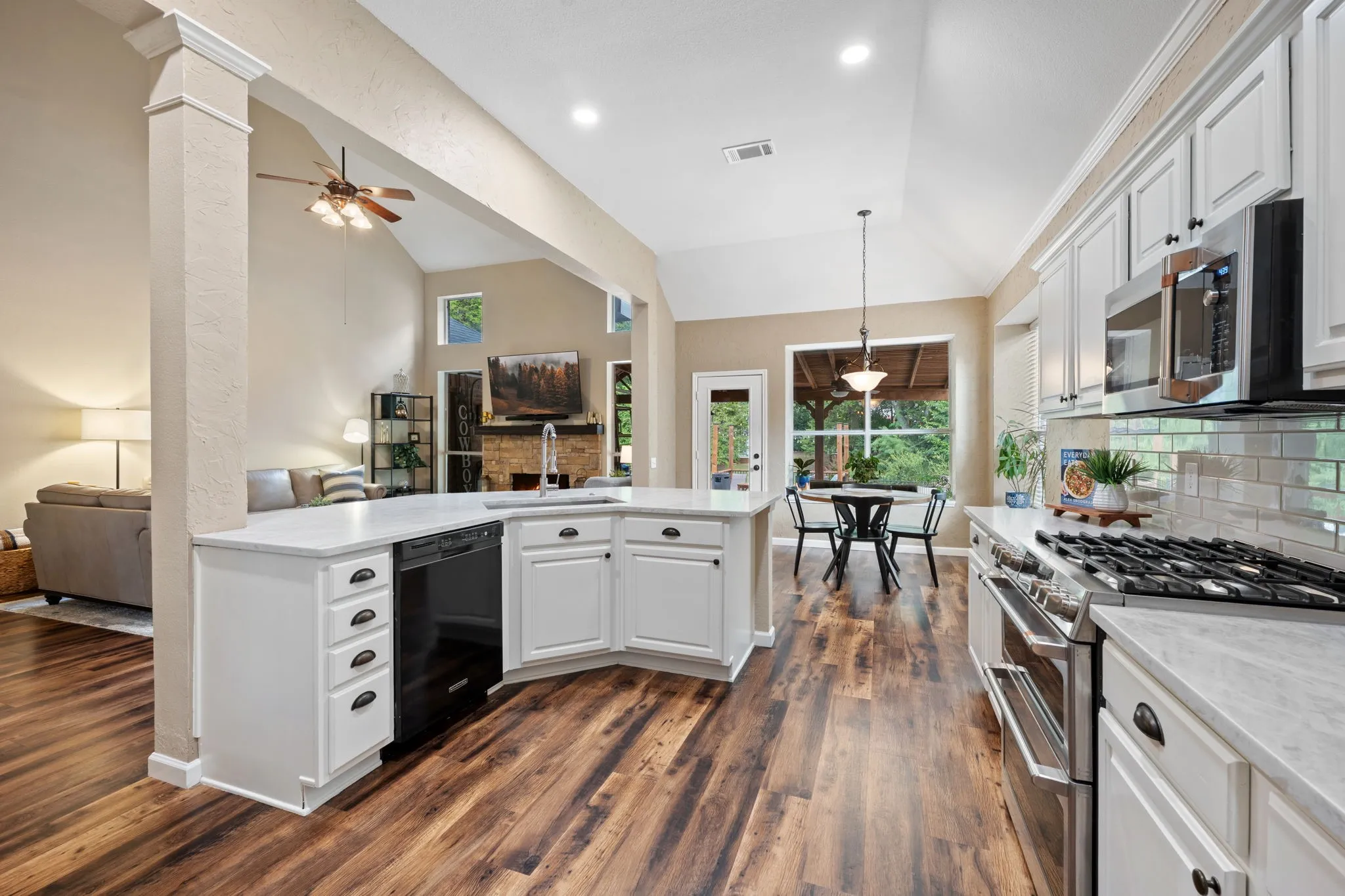Stunning kitchen remodeled in 2026 with stainless steel appliances, double oven, gas stove open to breakfast and living room
