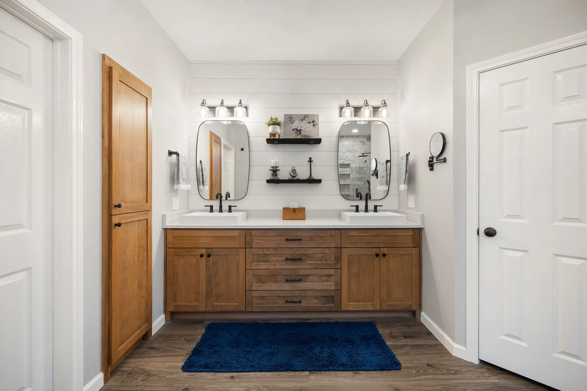 Dual vanity with wood-finish cabinetry, rectangular vessel sinks, and matte black fixtures