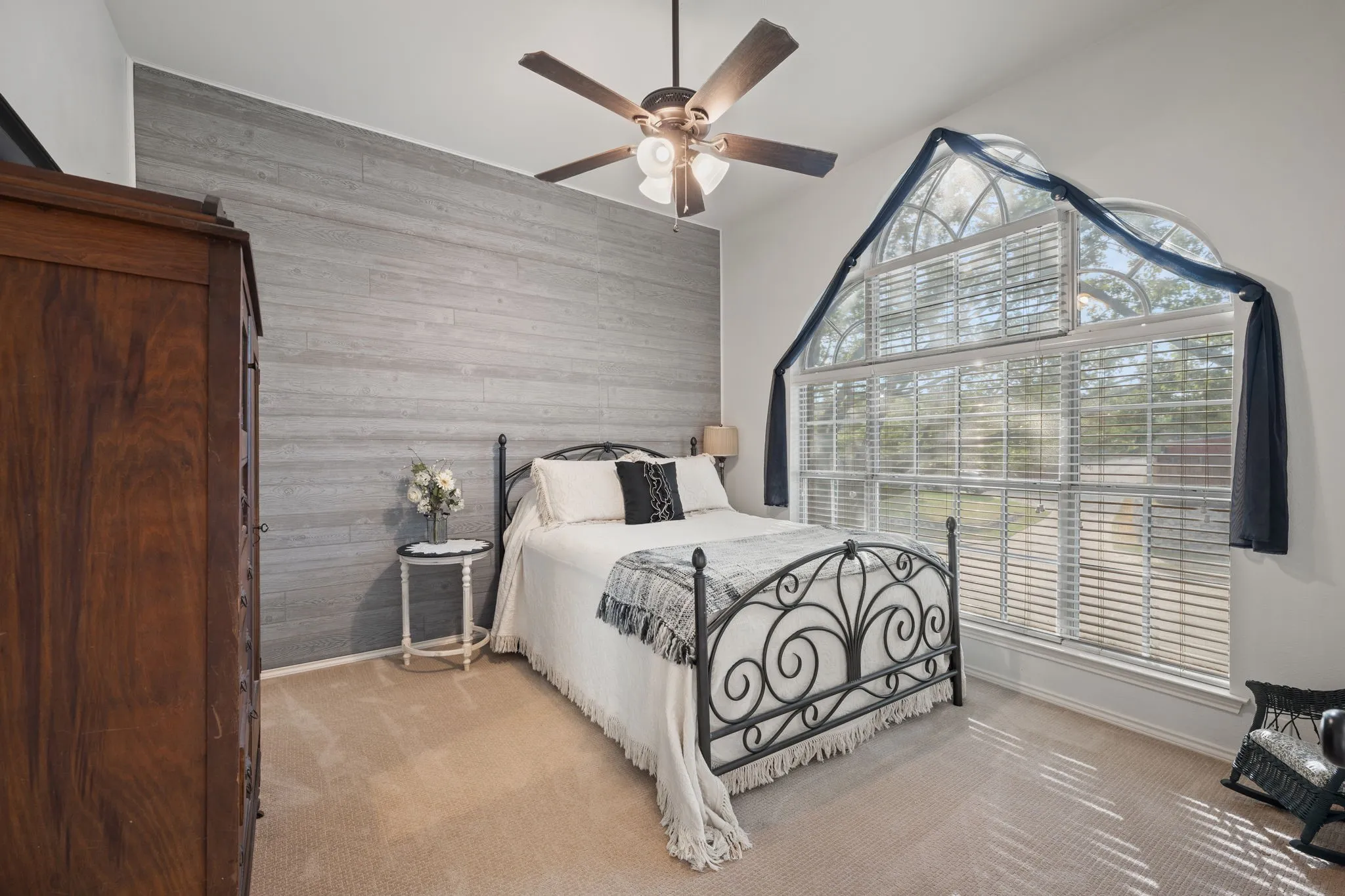 Large secondary bedroom with beautiful accent wall and walk in closet