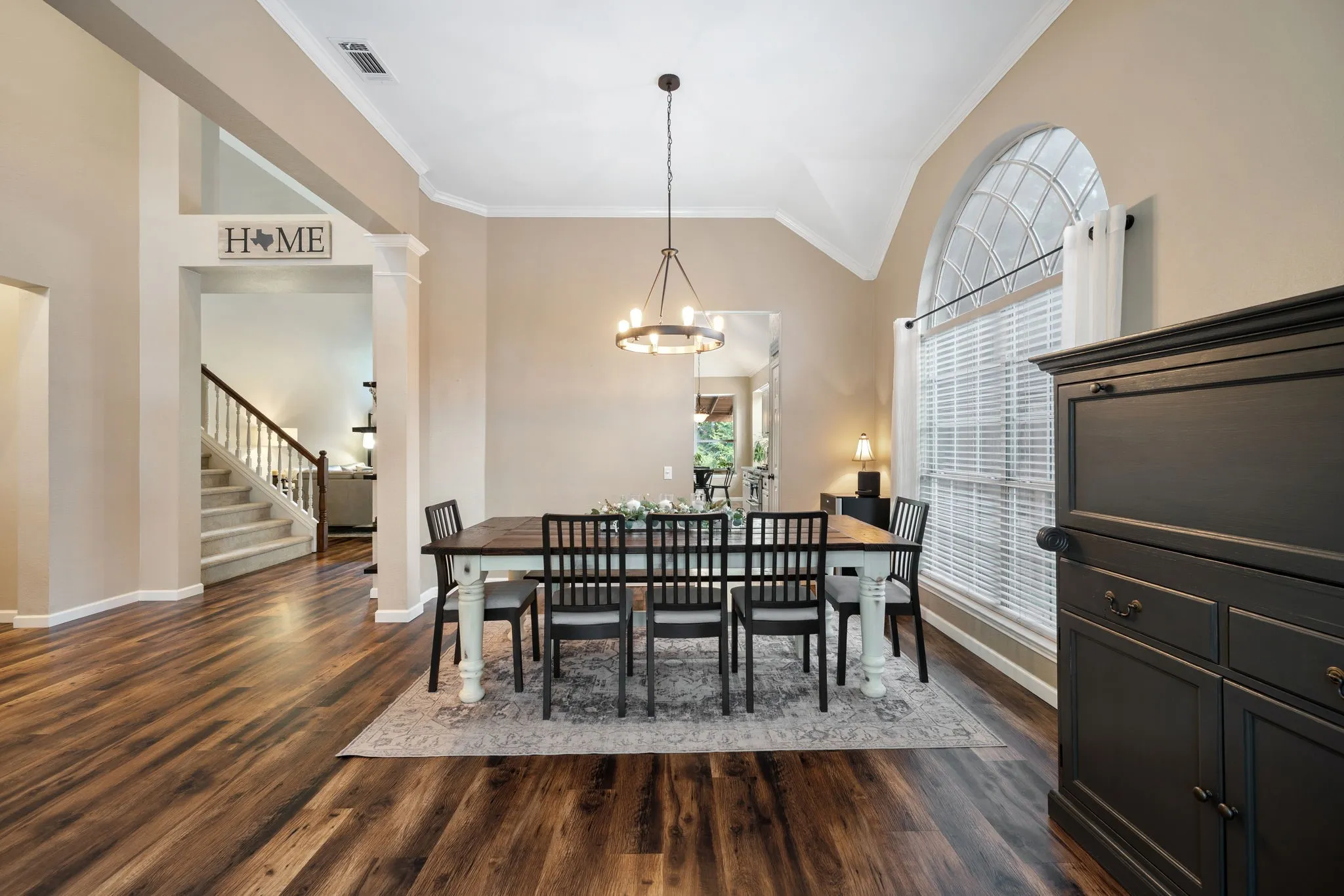 Dining area with entry to kitchen and living room