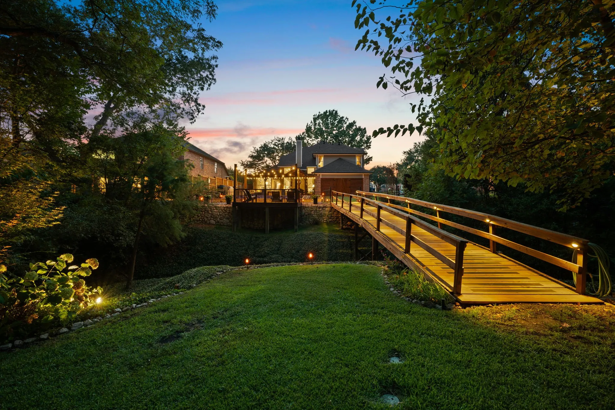 View of bridge and home from the back part of the lot