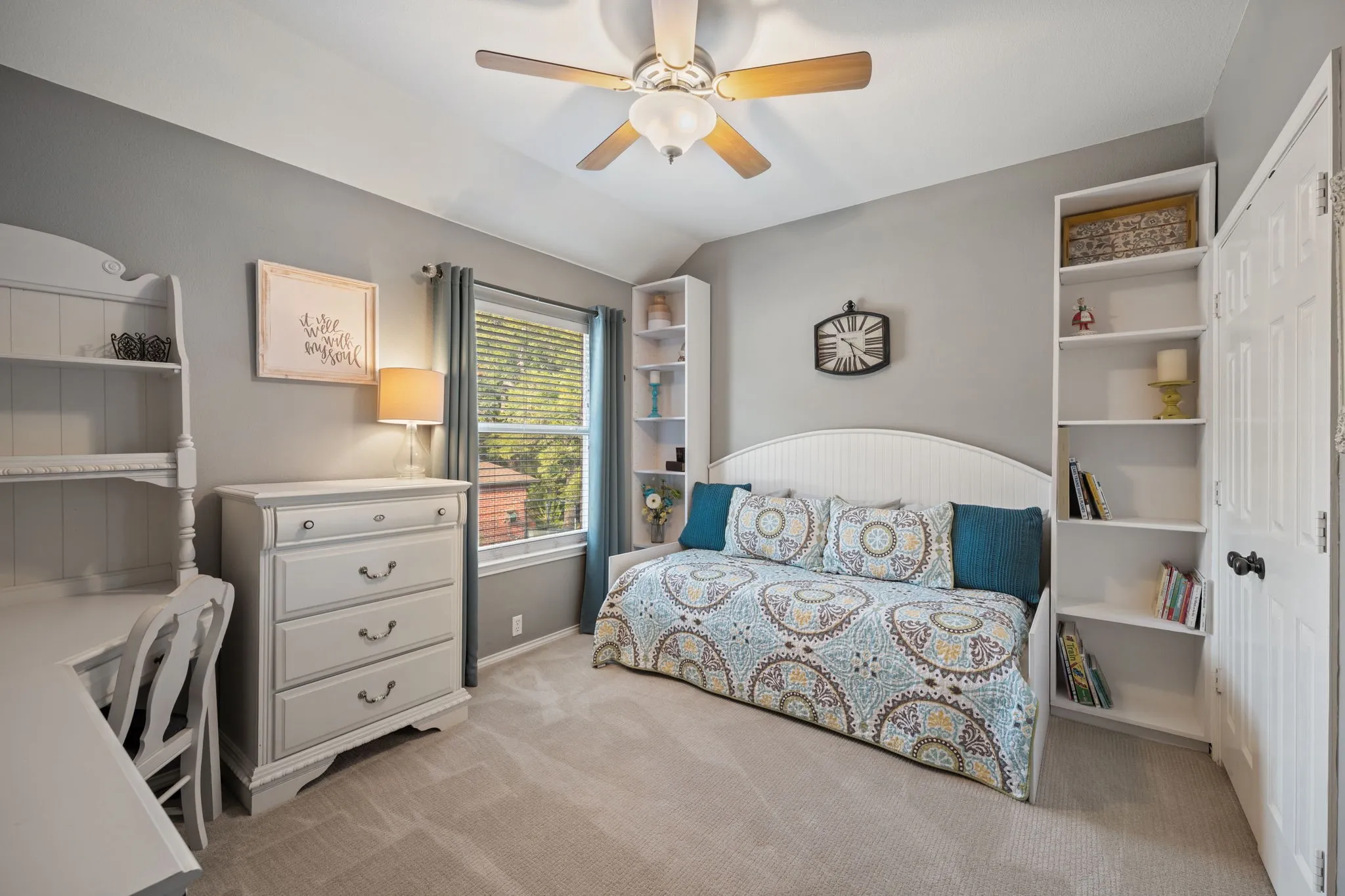 Spacious secondary bedroom with built in day bed and shelves