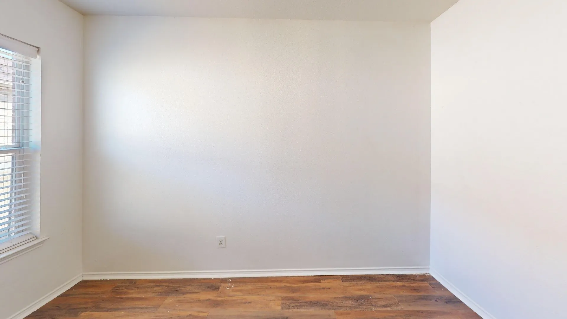 Wood-finish flooring with crisp white trim