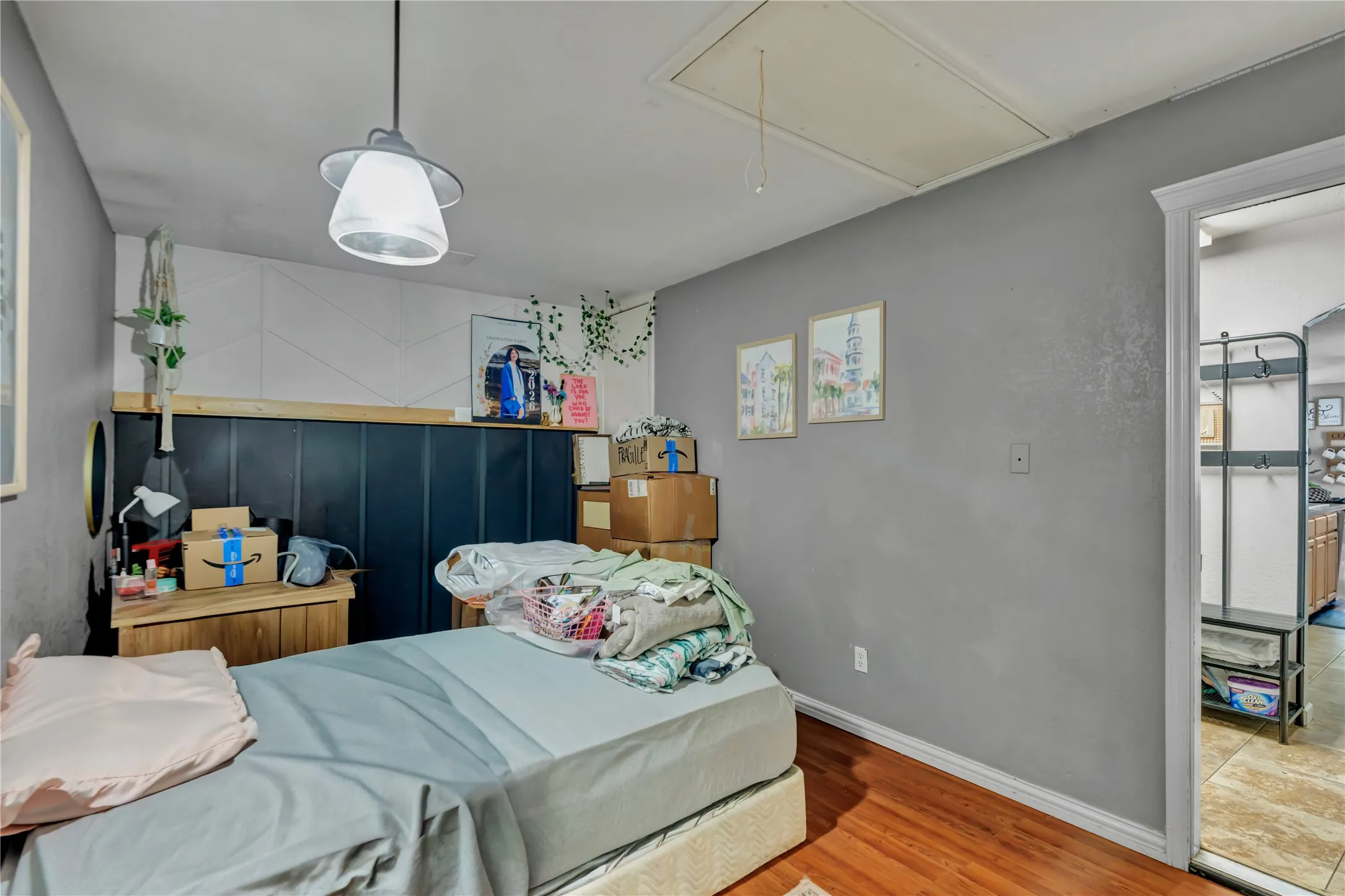 Wood-finish flooring with light gray walls and a white ceiling