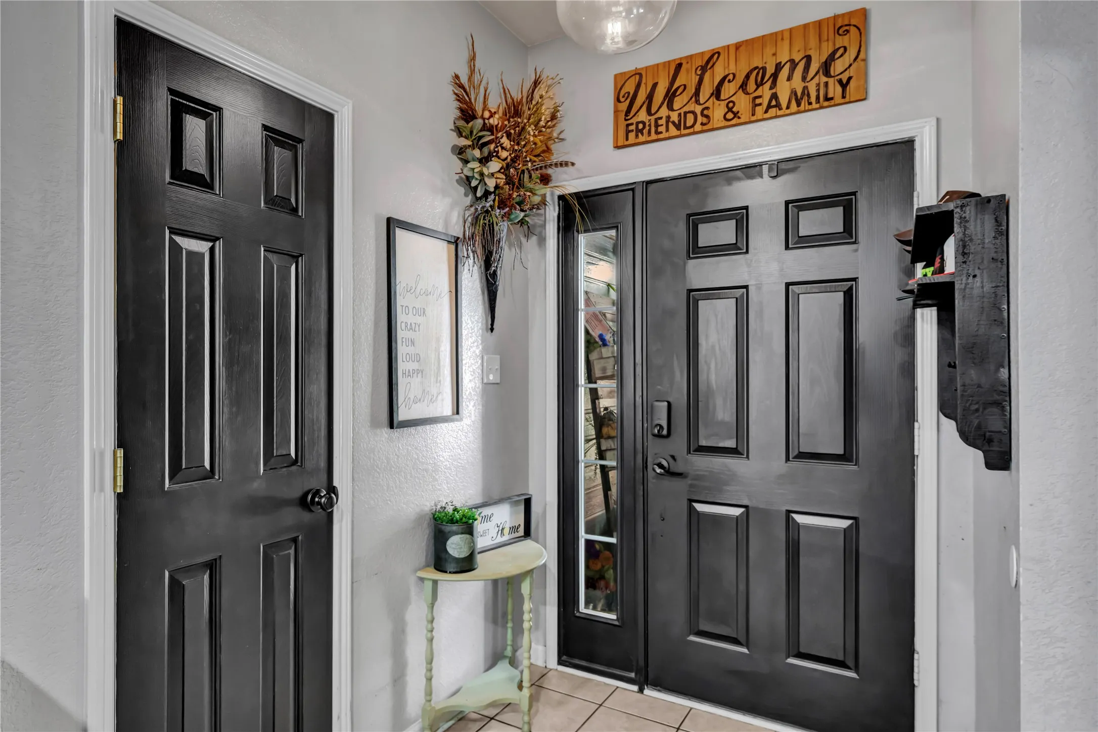 Double entry doors with sidelight panel and paneling detail
