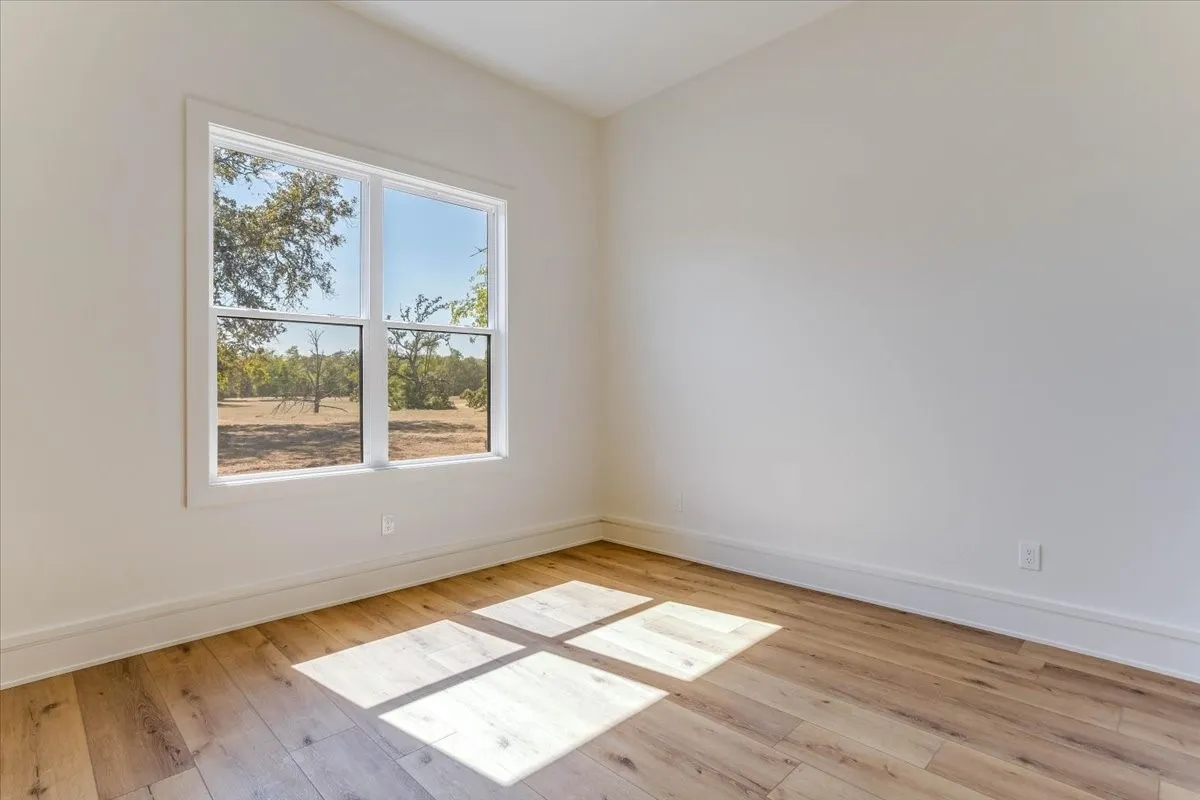 LVP flooring, white trim, and a double-pane window