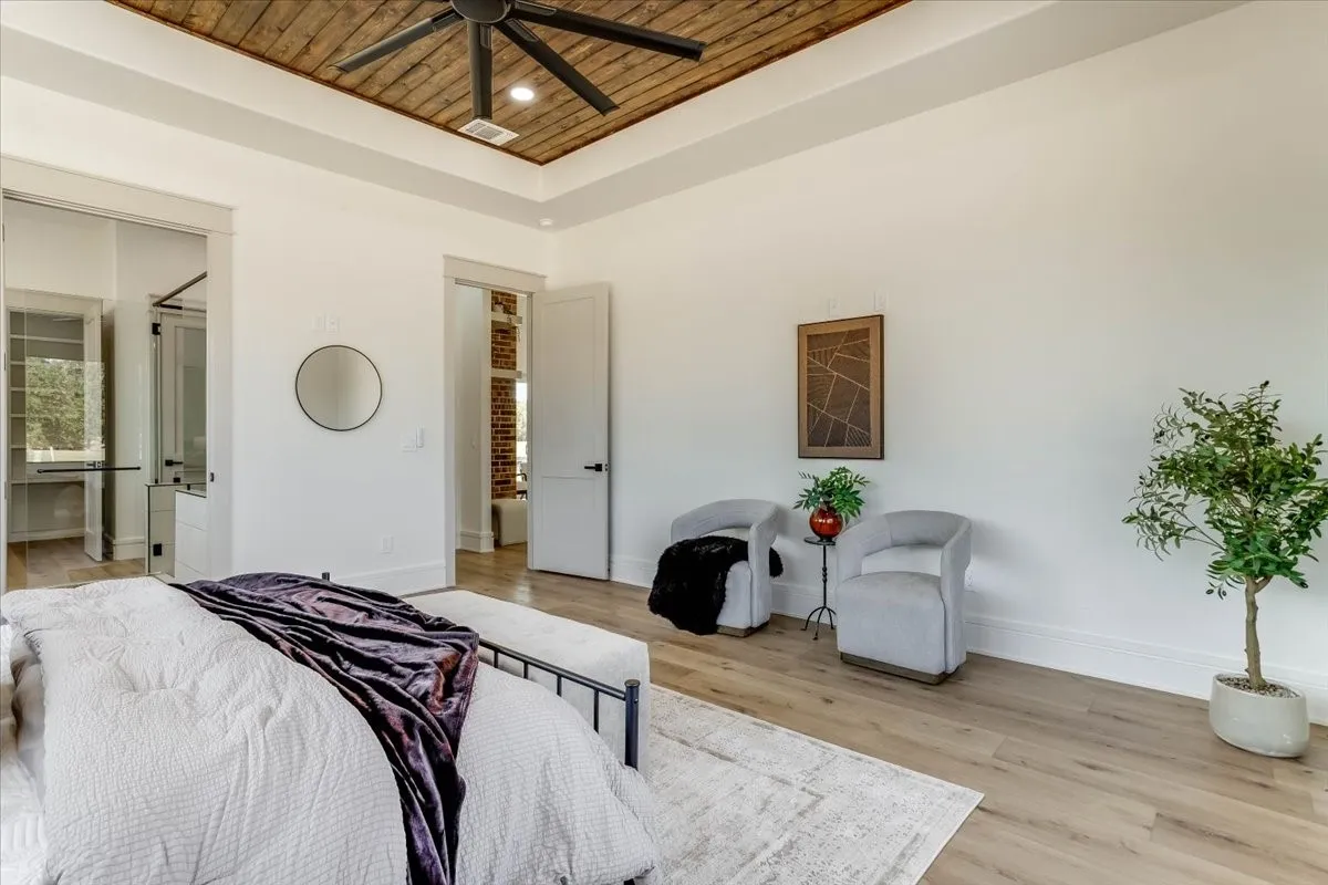 Tray ceiling with wood-finish paneling and recessed lighting
