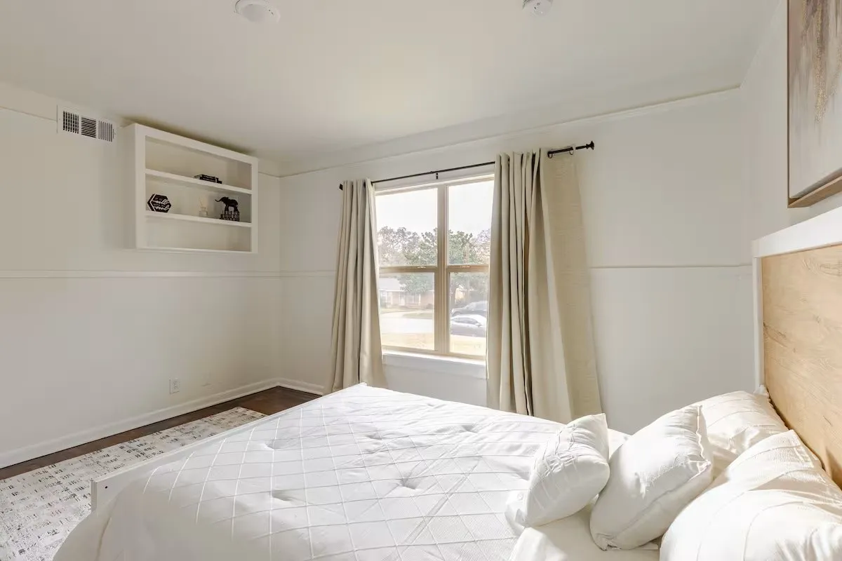 Hardwood-finish flooring, recessed lighting, and a built-in wall shelf