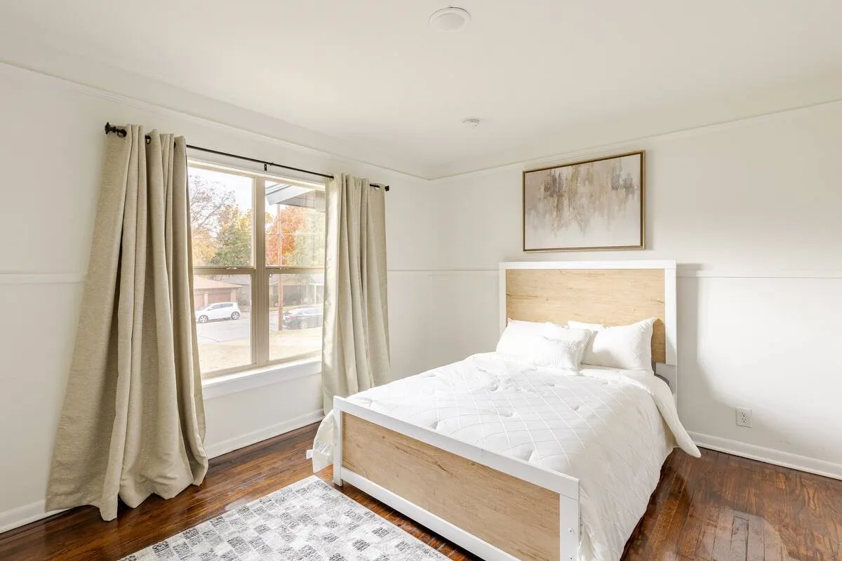 Hardwood flooring, crisp white walls, single window, recessed lighting