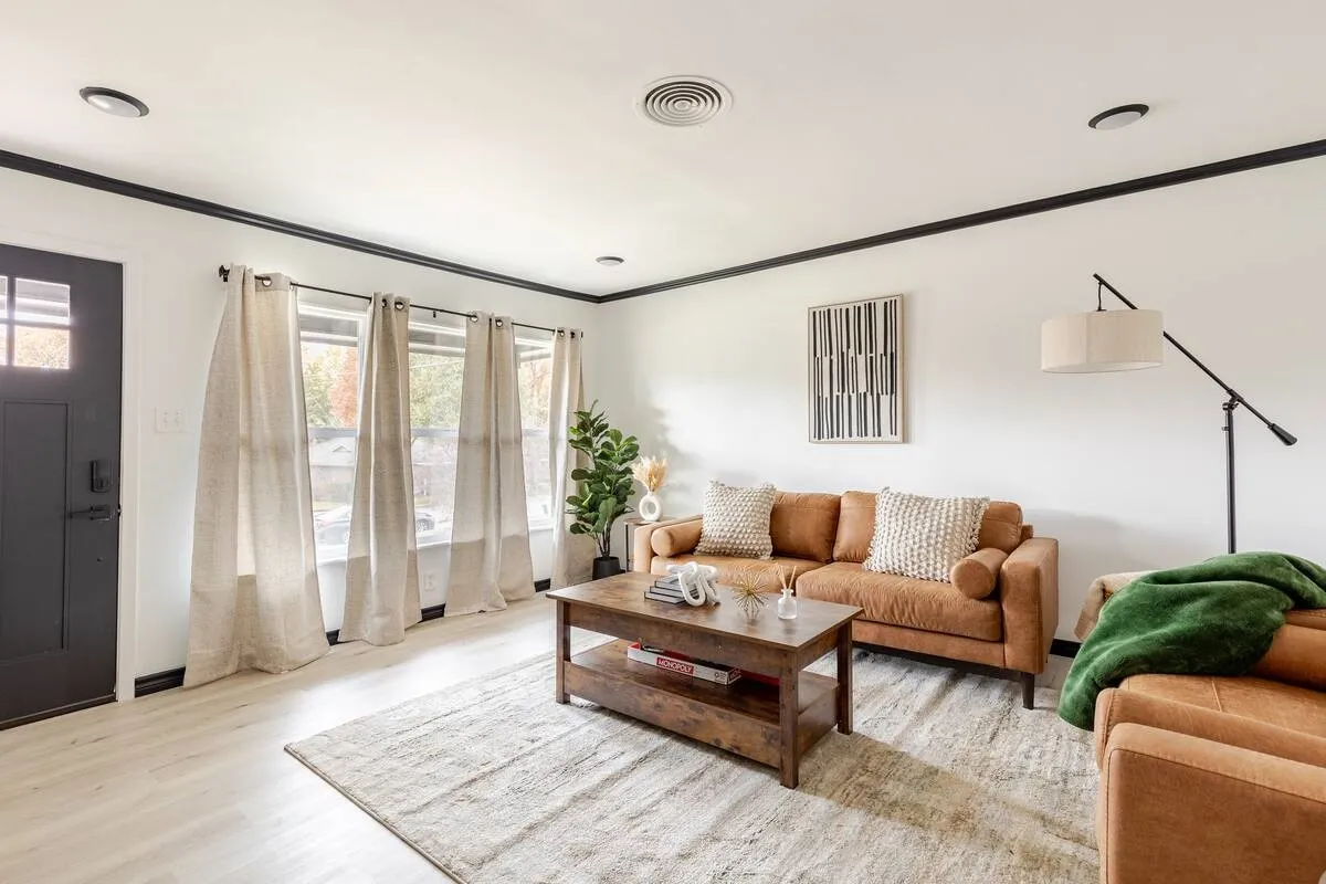 Entry door with window panes, wood-finish flooring, recessed lighting, and crown molding