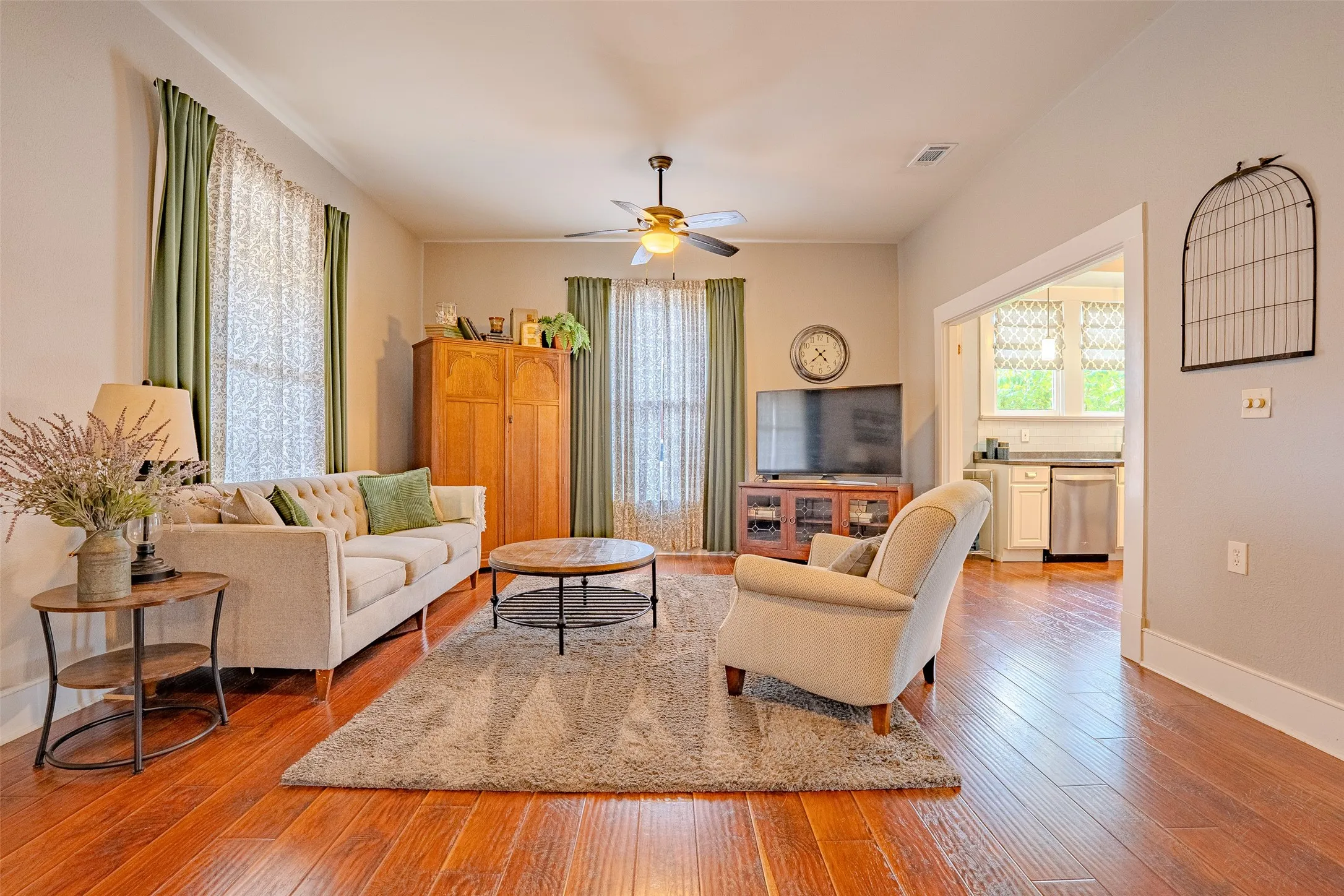 Laminate flooring, recessed lighting, and ceiling fan