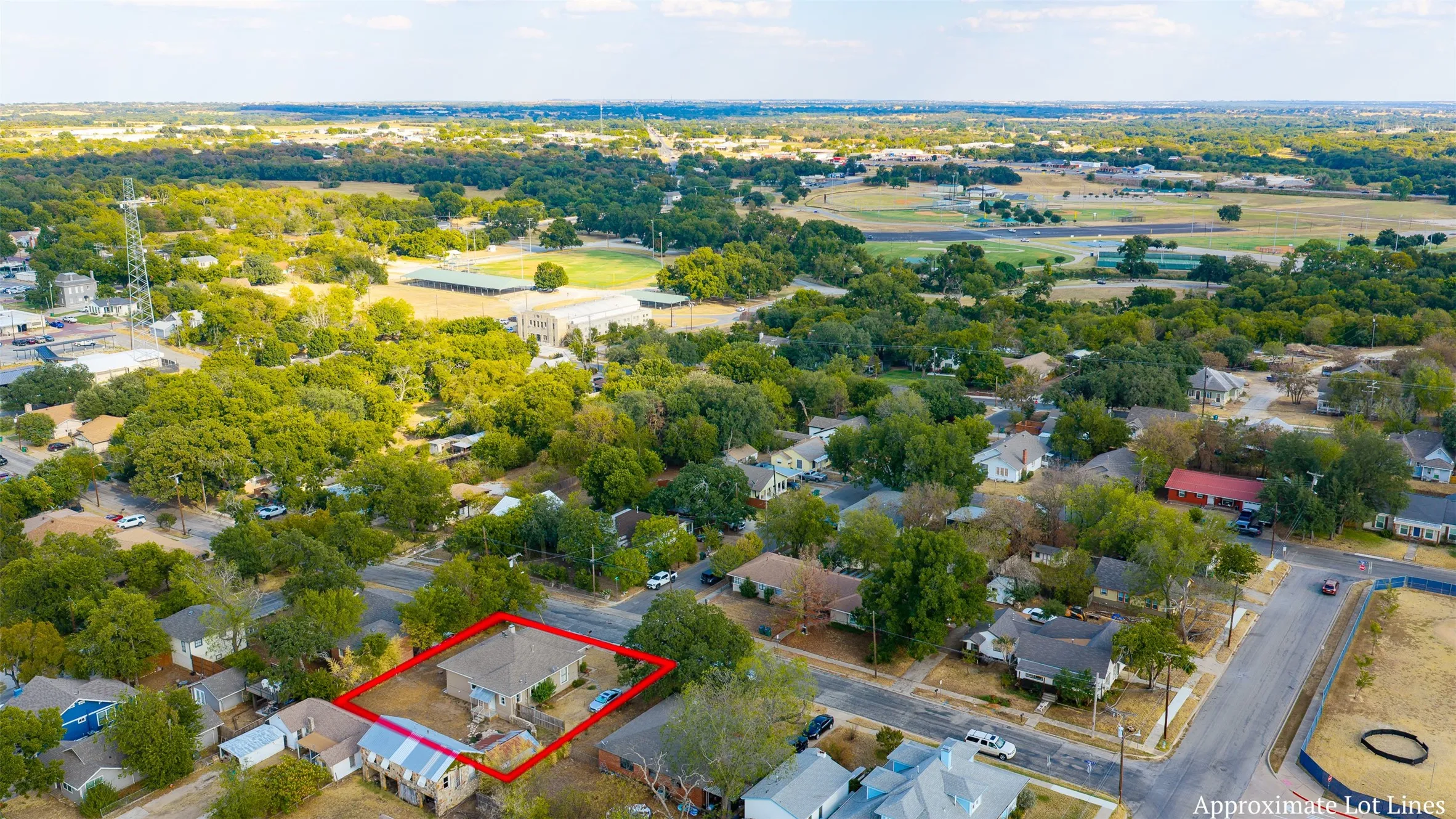 Aerial perspective showcasing the property within a residential neighborhood