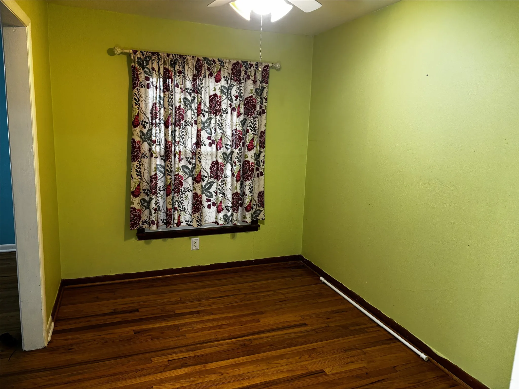 Wood-finish flooring with light green walls