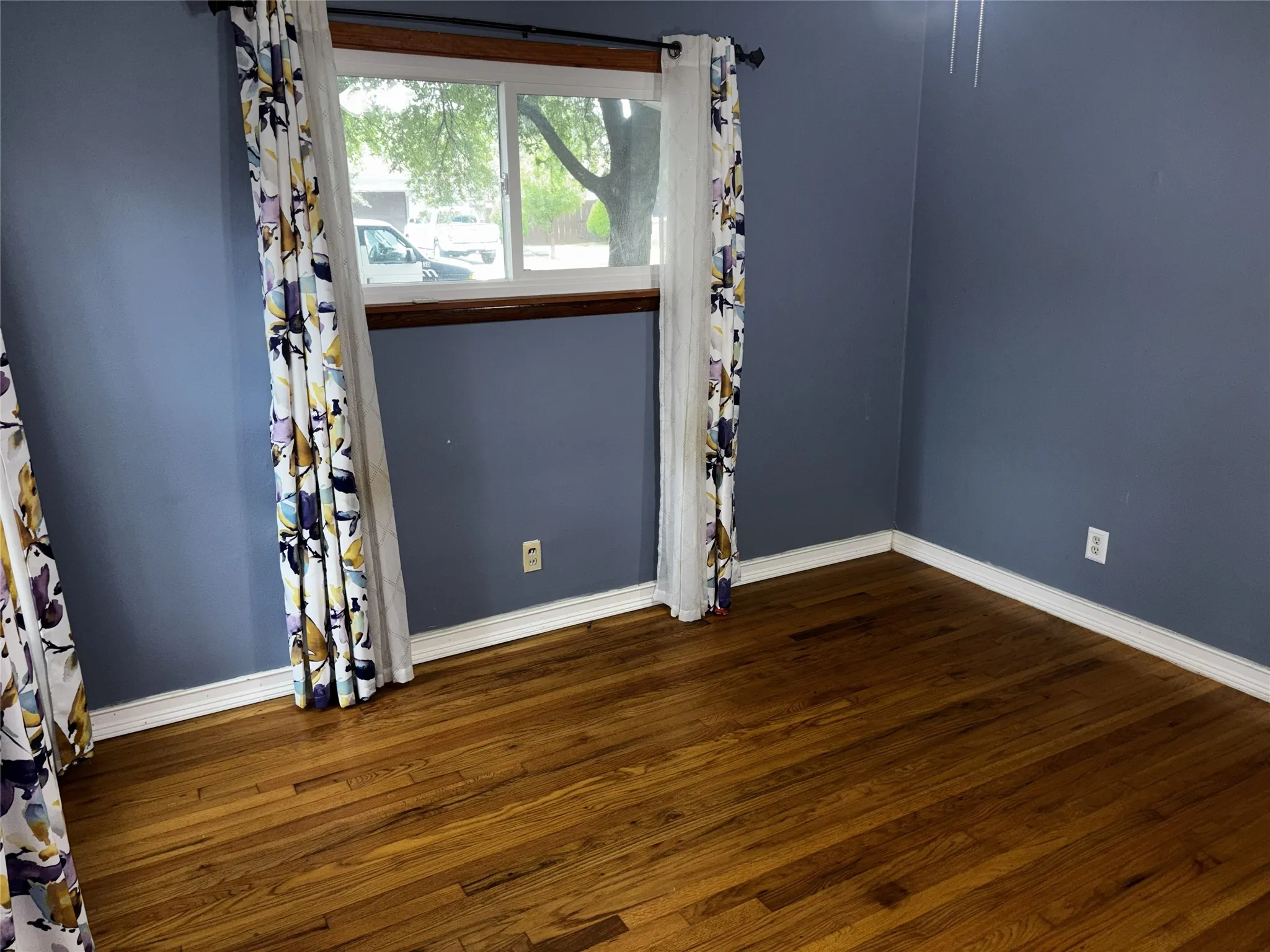 White-framed double-hung window with a sill