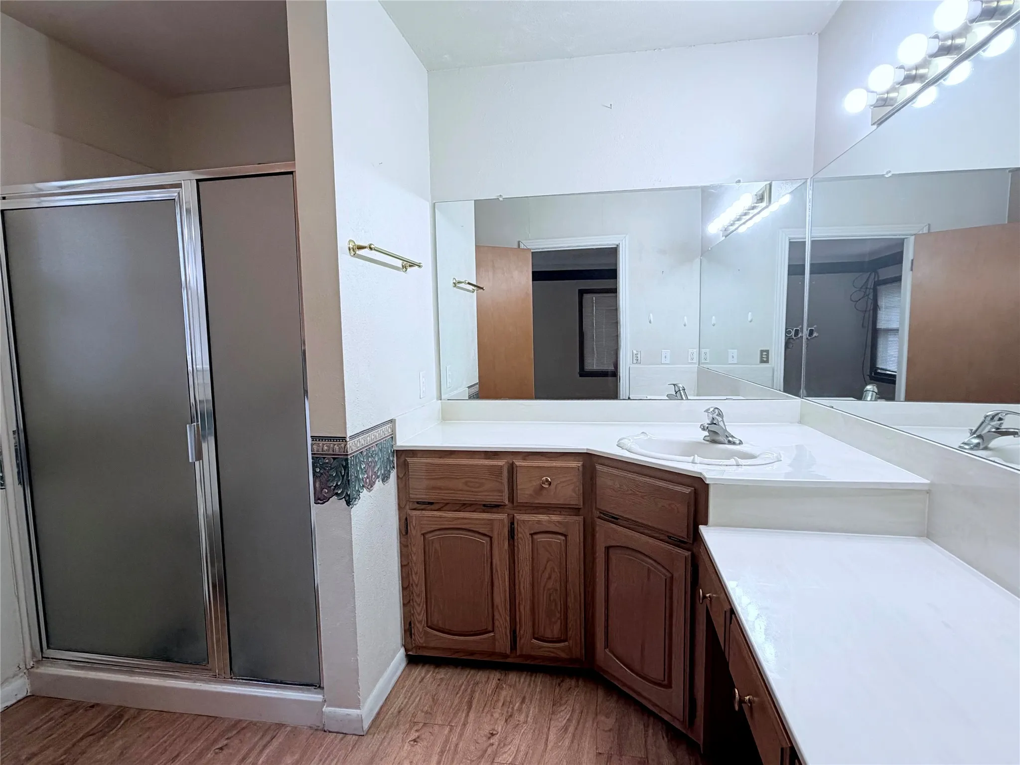 Bath with walk-in shower.
