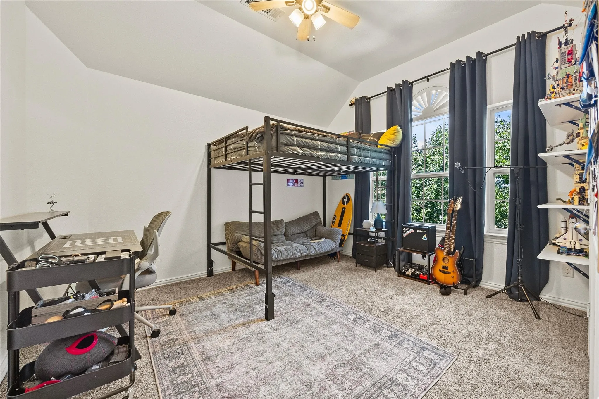 Carpeted flooring with a ceiling fan